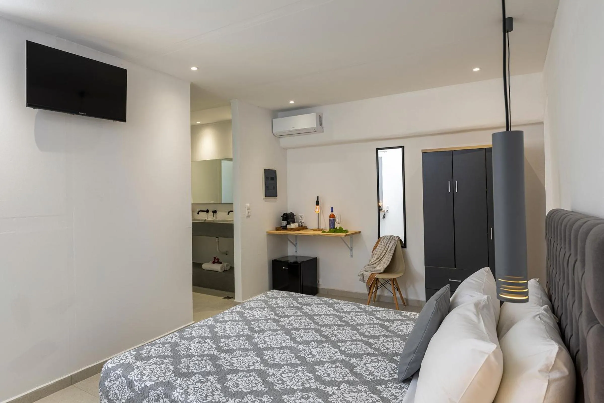 Bed in Chrysonisos Suites with Sunset & Seaviews near Kini
