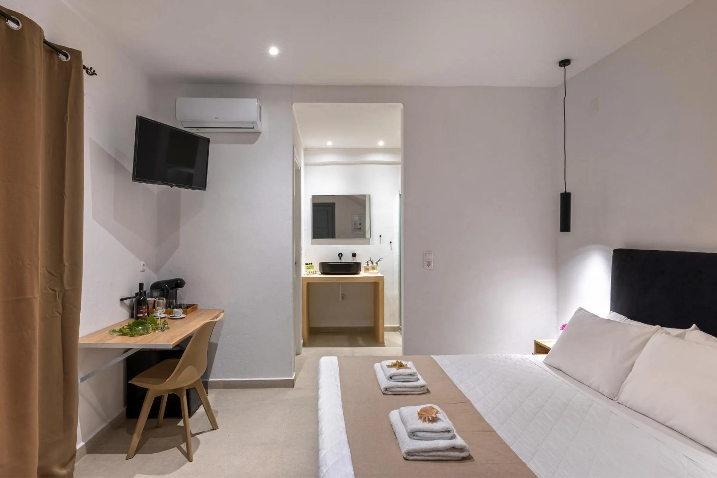 Bedroom, Bed in Chrysonisos Suites with Sunset & Seaviews near Kini