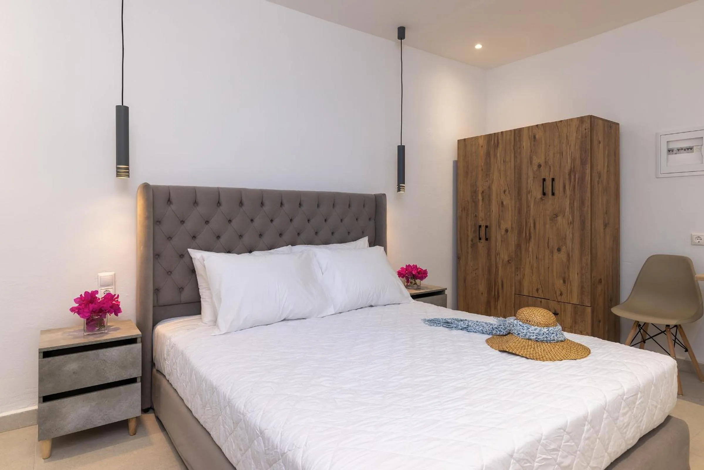 Bed in Chrysonisos Suites with Sunset & Seaviews near Kini