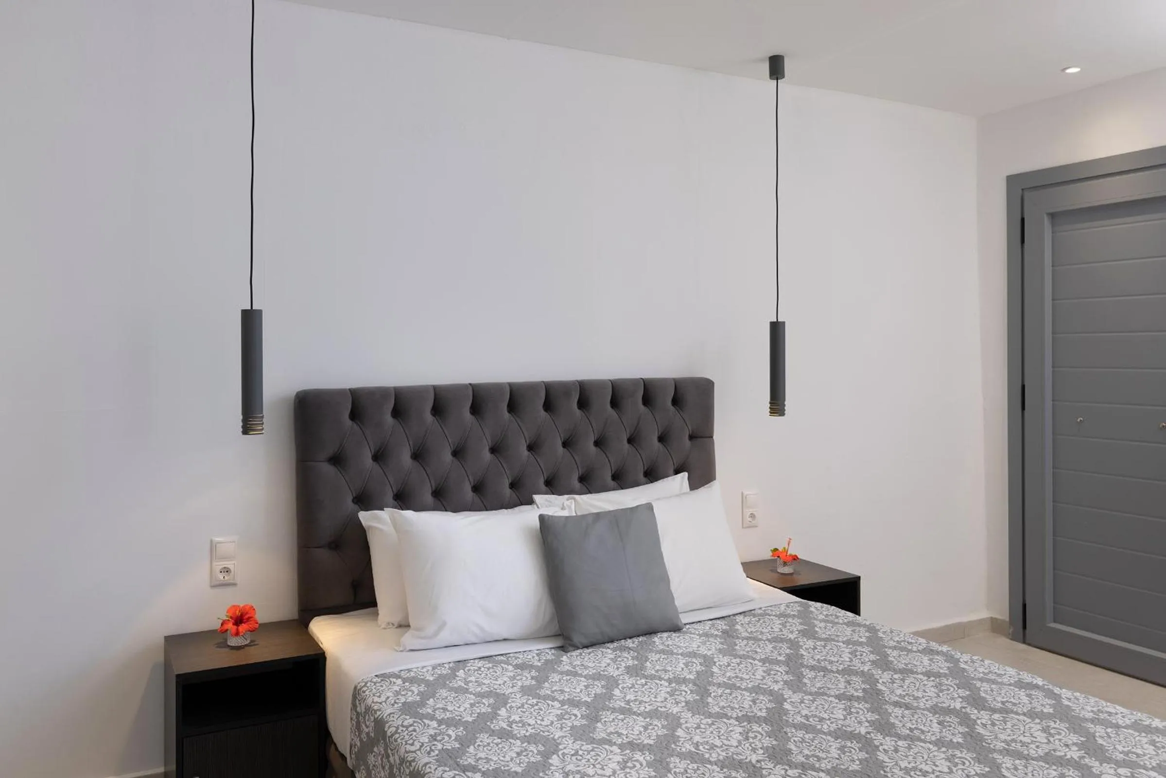 Bed in Chrysonisos Suites with Sunset & Seaviews near Kini