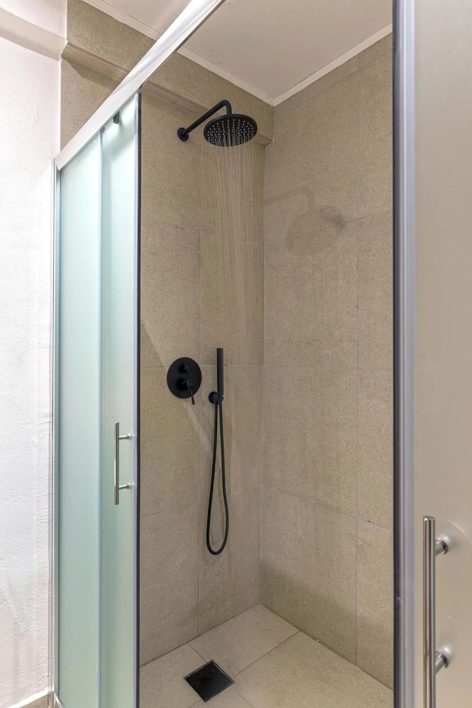 Shower in Chrysonisos Suites with Sunset & Seaviews near Kini