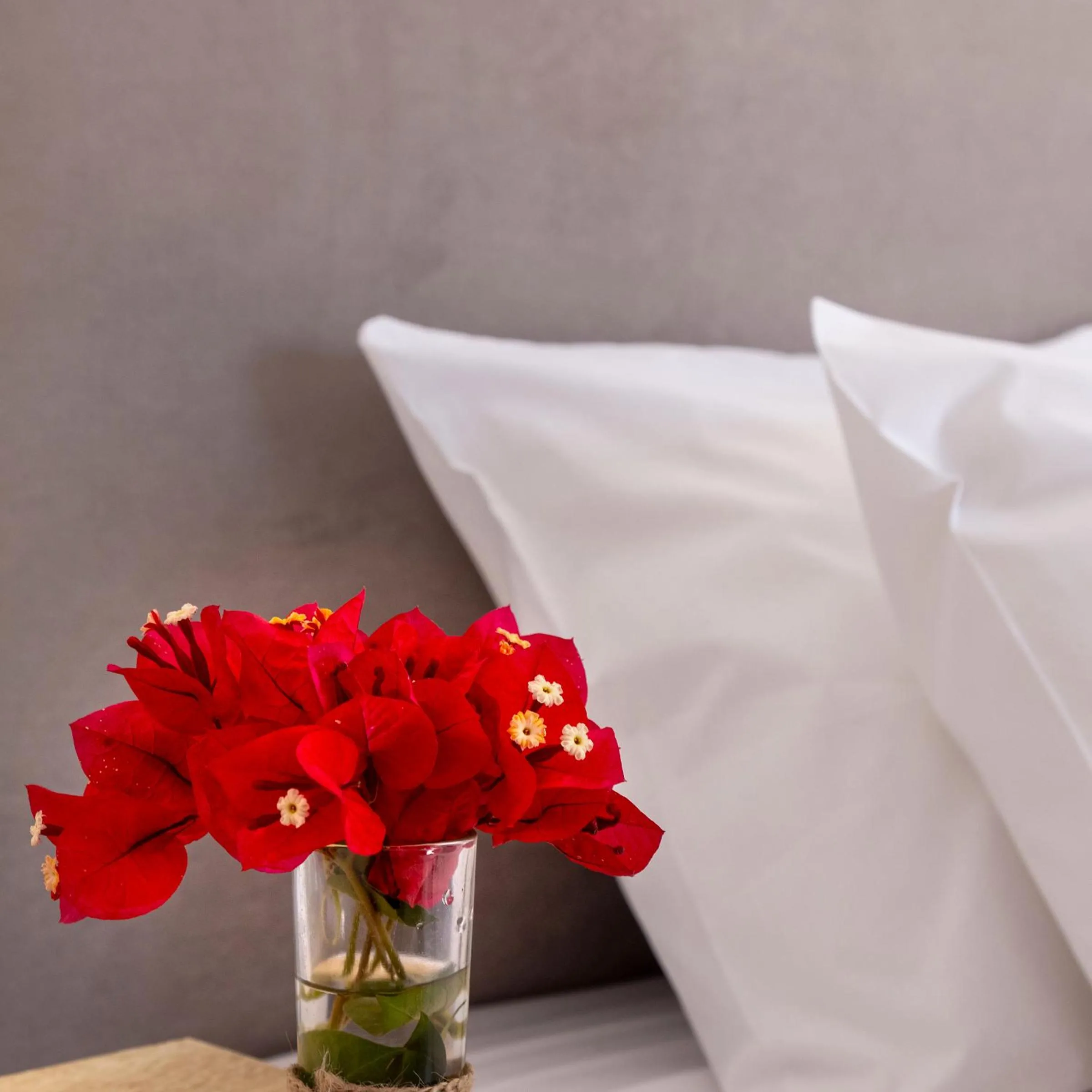 Bed in Chrysonisos Suites with Sunset & Seaviews near Kini