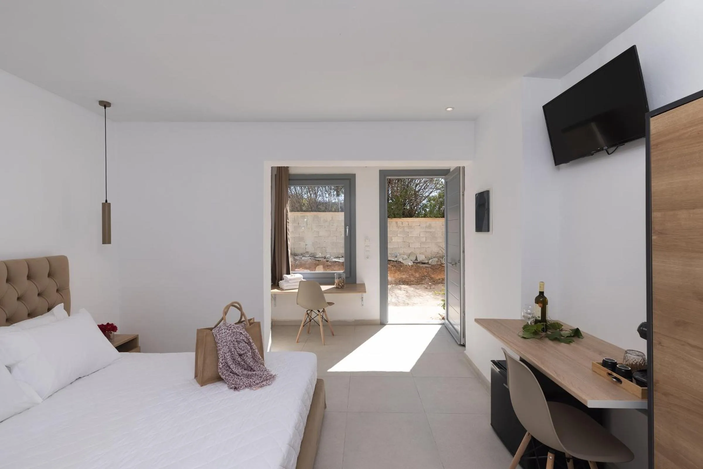 Bed in Chrysonisos Suites with Sunset & Seaviews near Kini