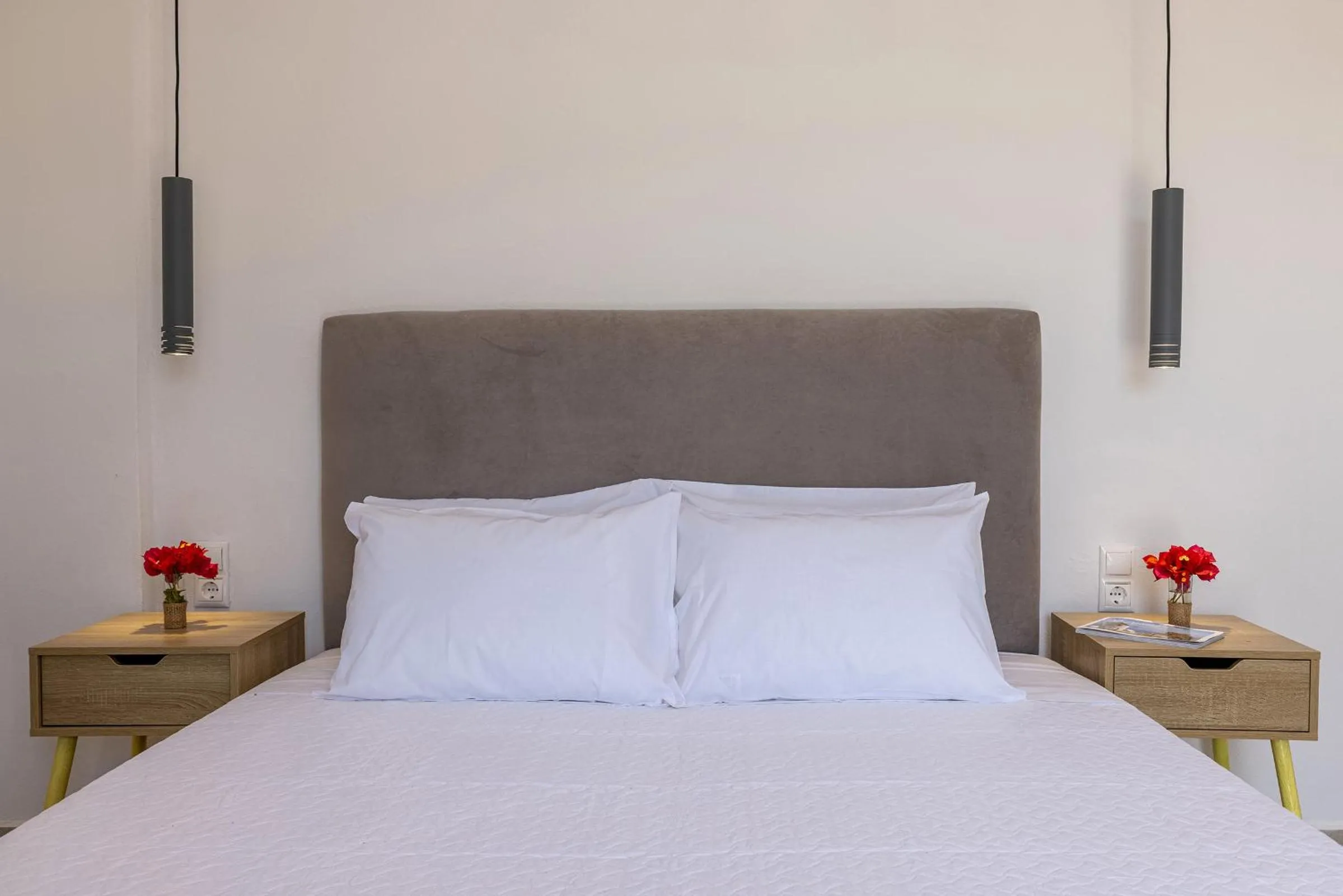 Bed in Chrysonisos Suites with Sunset & Seaviews near Kini