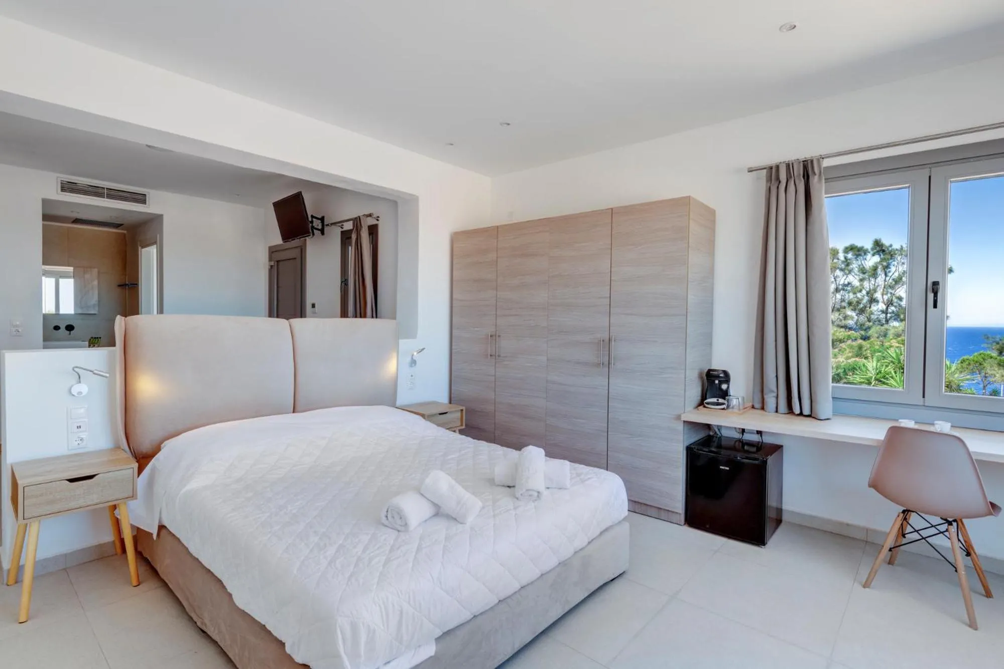 Photo of the whole room, Bed in Chrysonisos Suites with Sunset & Seaviews near Kini