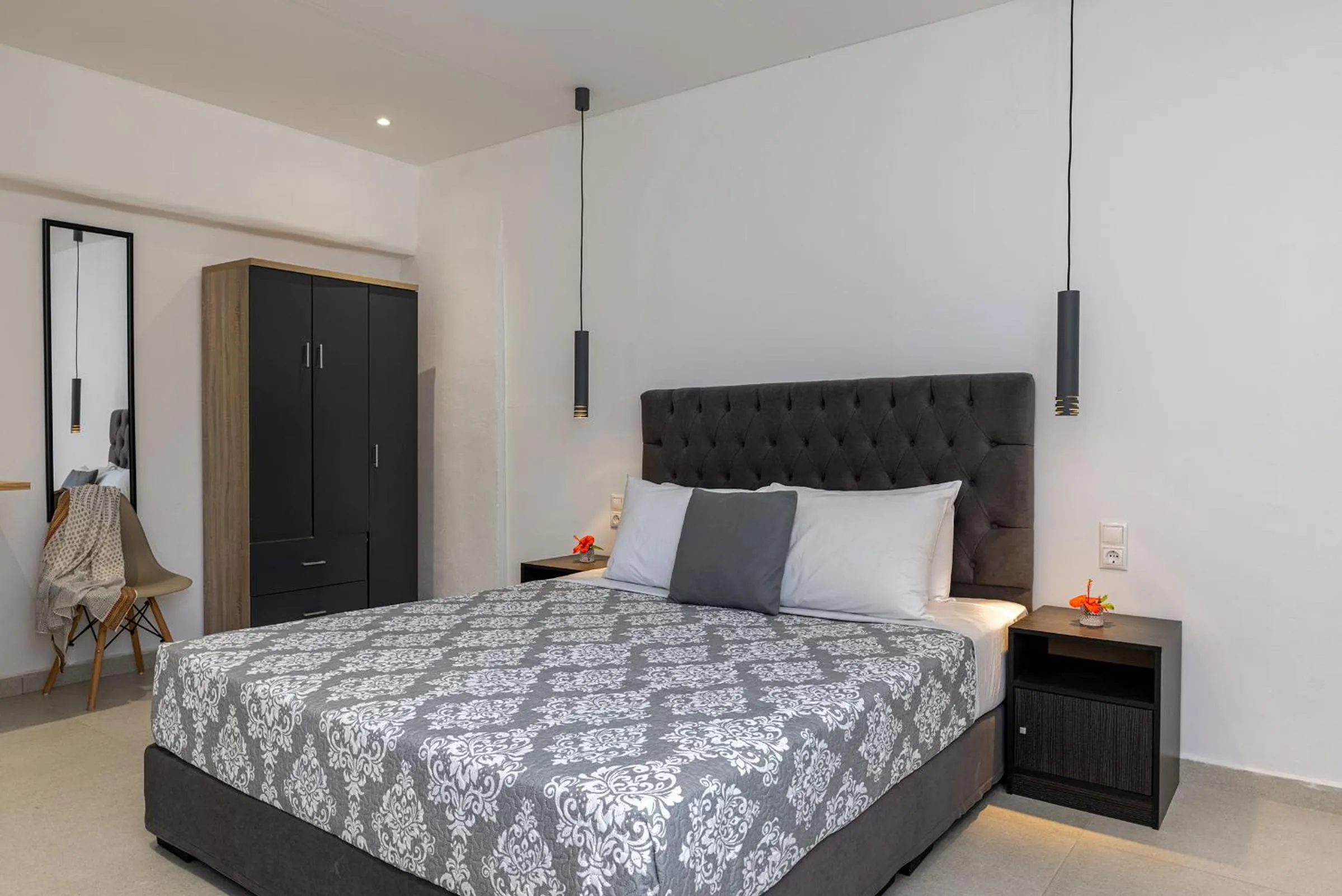 Bed in Chrysonisos Suites with Sunset & Seaviews near Kini