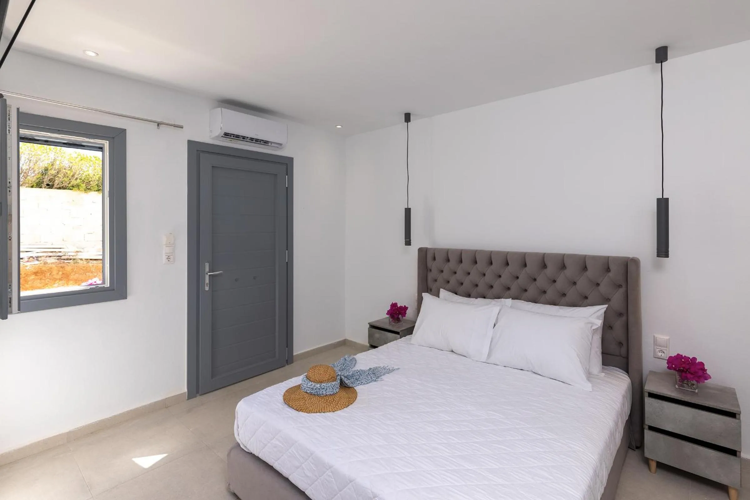 Bed in Chrysonisos Suites with Sunset & Seaviews near Kini