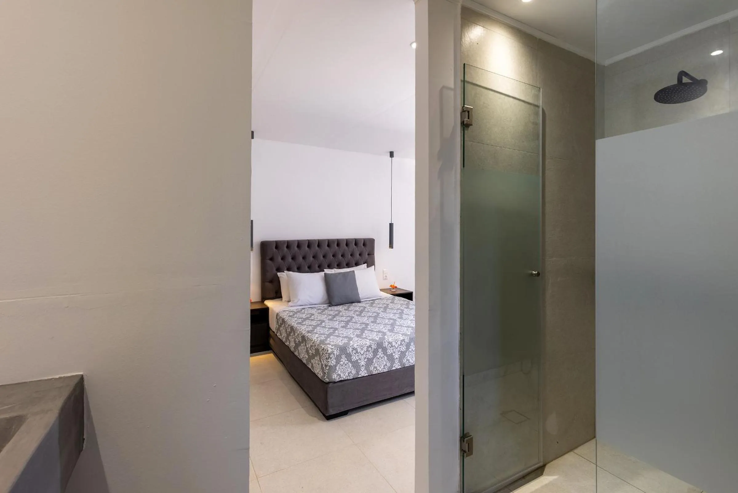 Bed in Chrysonisos Suites with Sunset & Seaviews near Kini