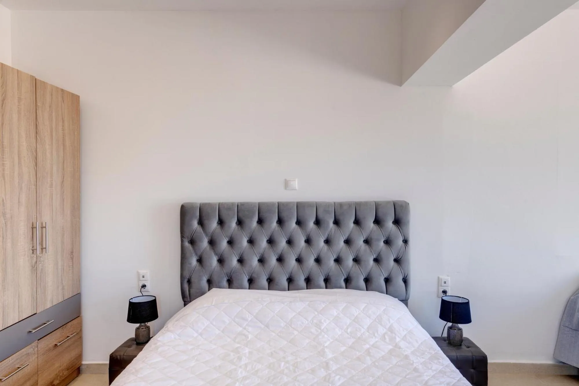Bed in Chrysonisos Suites with Sunset & Seaviews near Kini