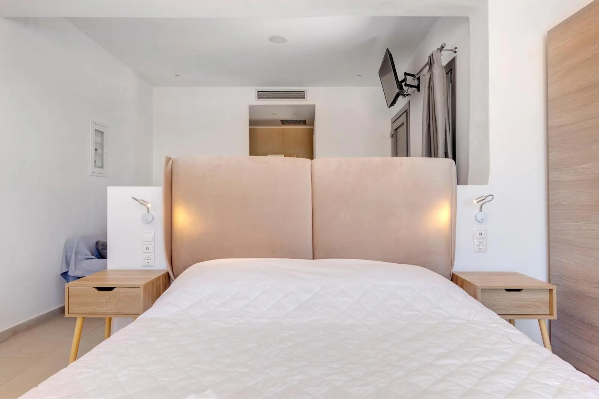 Bed in Chrysonisos Suites with Sunset & Seaviews near Kini