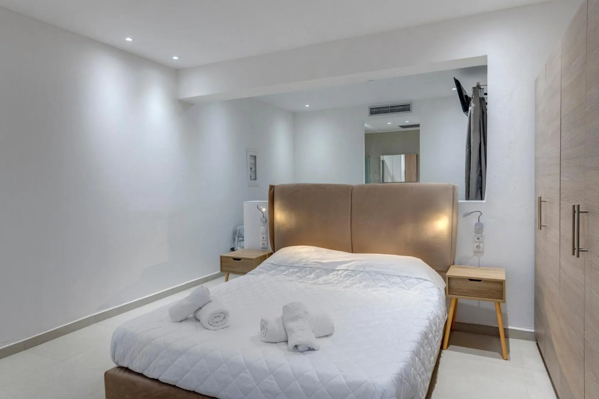 Photo of the whole room, Bed in Chrysonisos Suites with Sunset & Seaviews near Kini