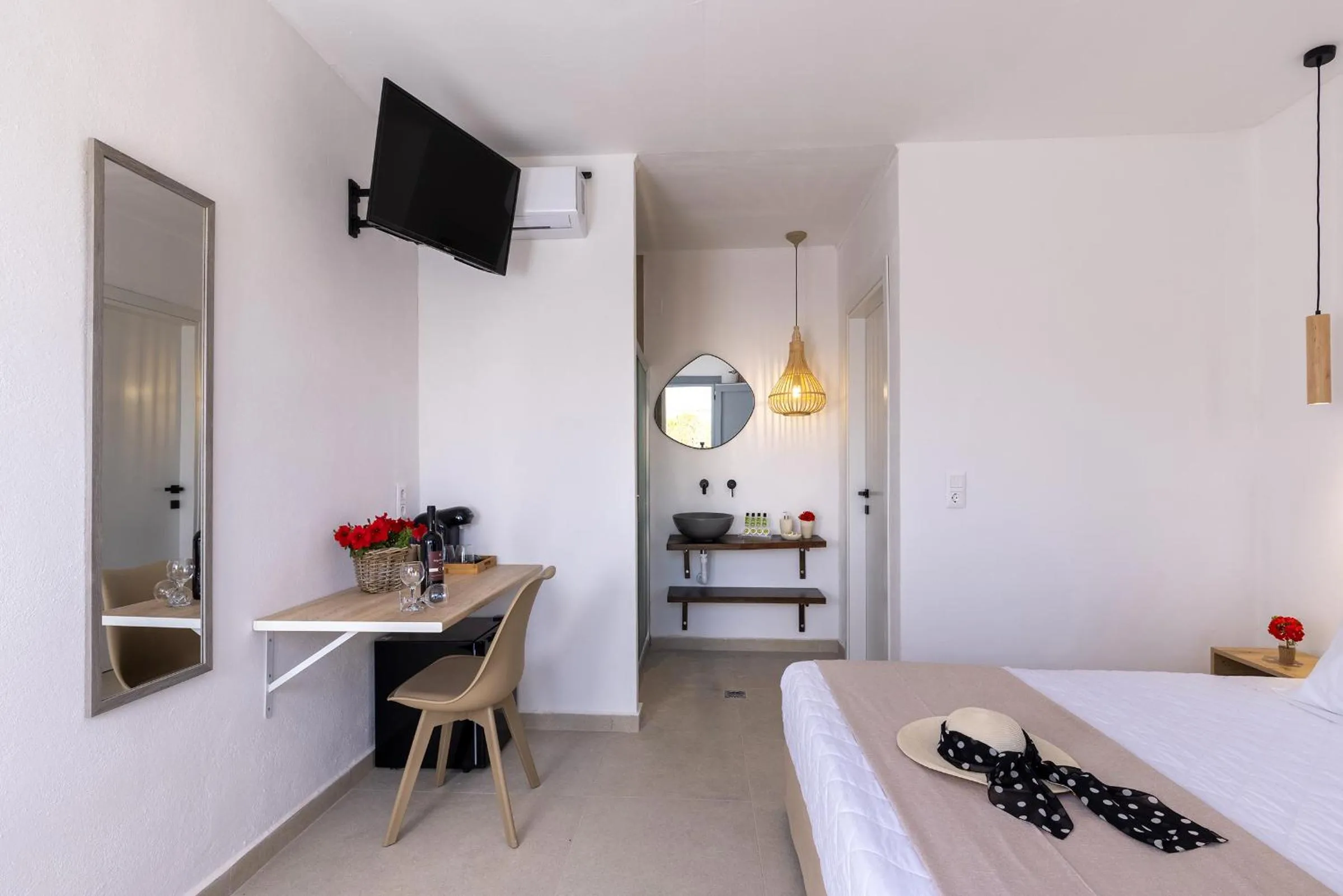 Photo of the whole room, Bed in Chrysonisos Suites with Sunset & Seaviews near Kini