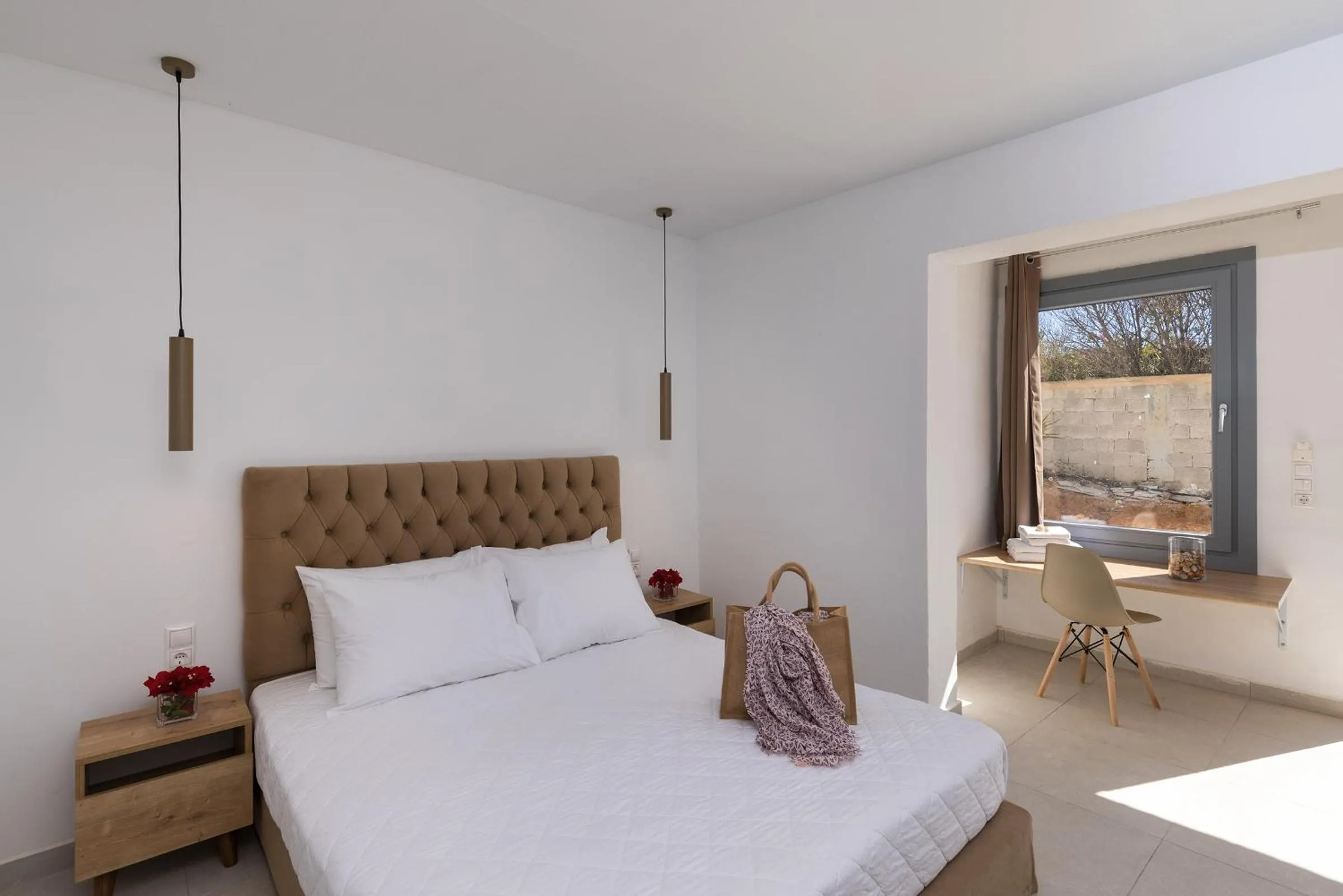 Bed in Chrysonisos Suites with Sunset & Seaviews near Kini