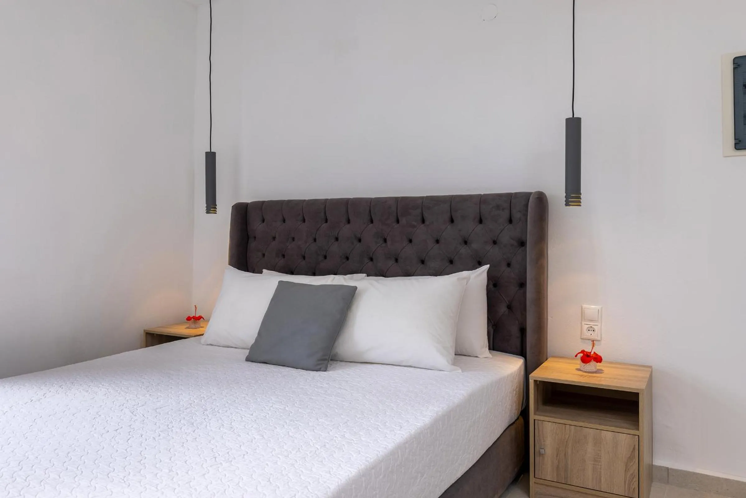 Bed in Chrysonisos Suites with Sunset & Seaviews near Kini