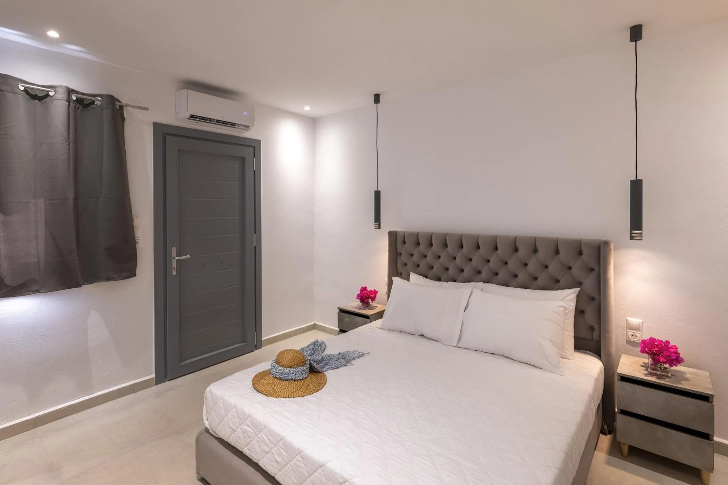Bed in Chrysonisos Suites with Sunset & Seaviews near Kini