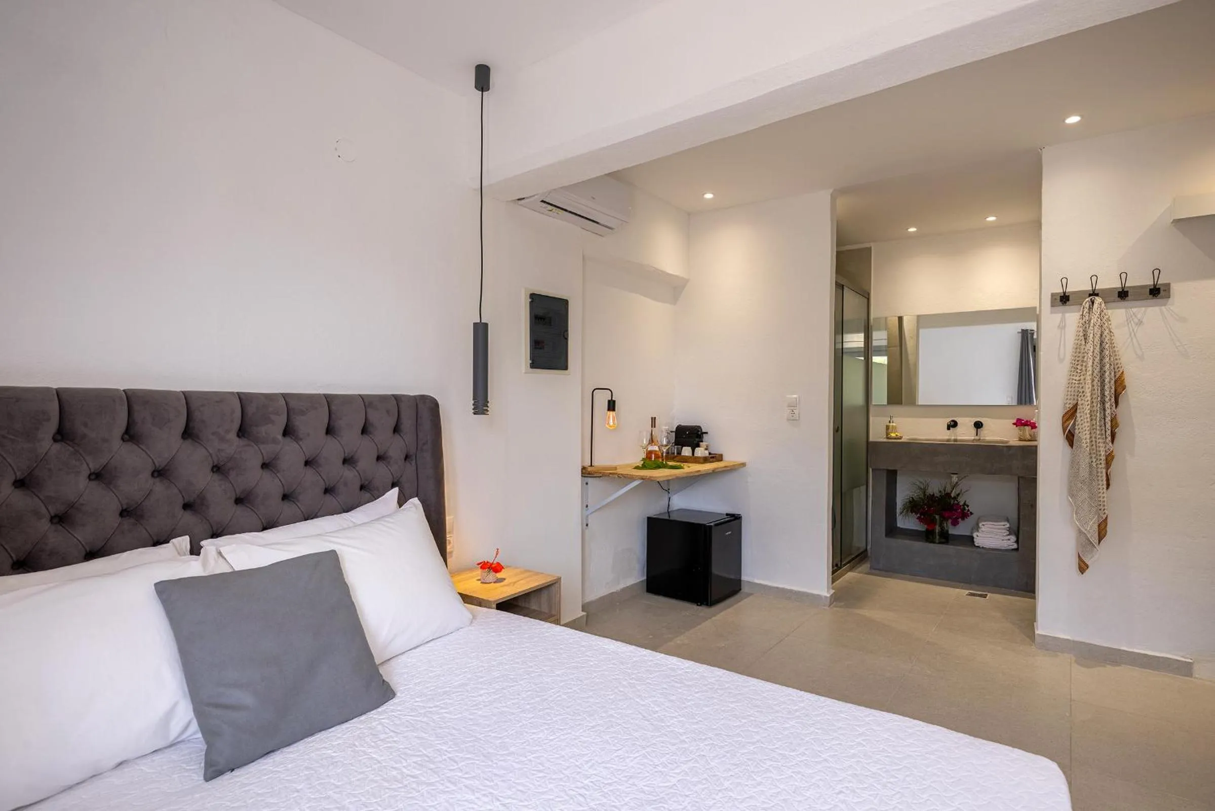 Bed in Chrysonisos Suites with Sunset & Seaviews near Kini