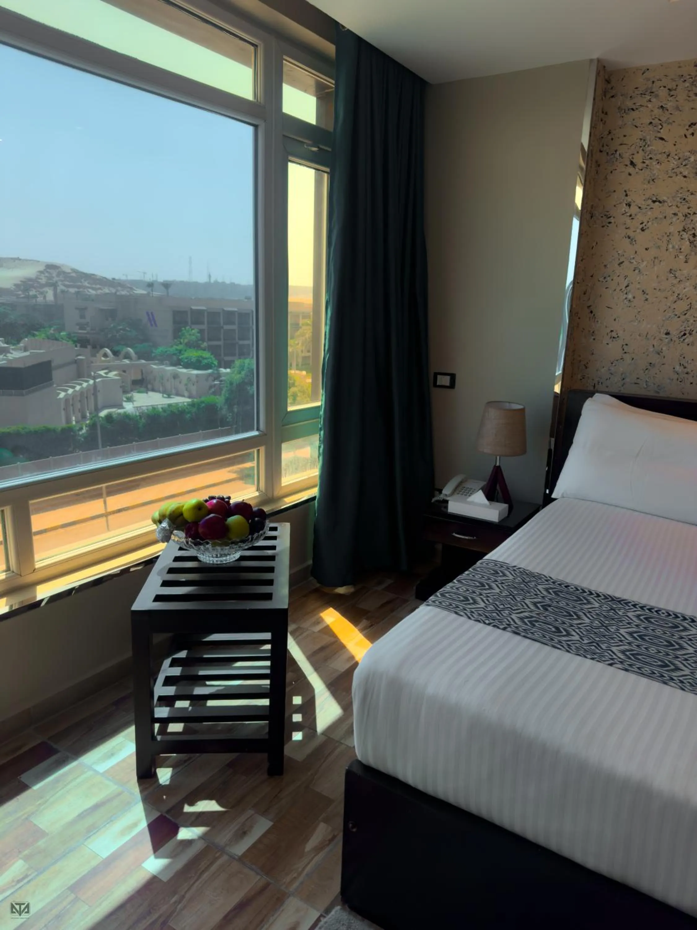 Bed in Turquoise Pyramids & Grand Egyptian museum view Hotel