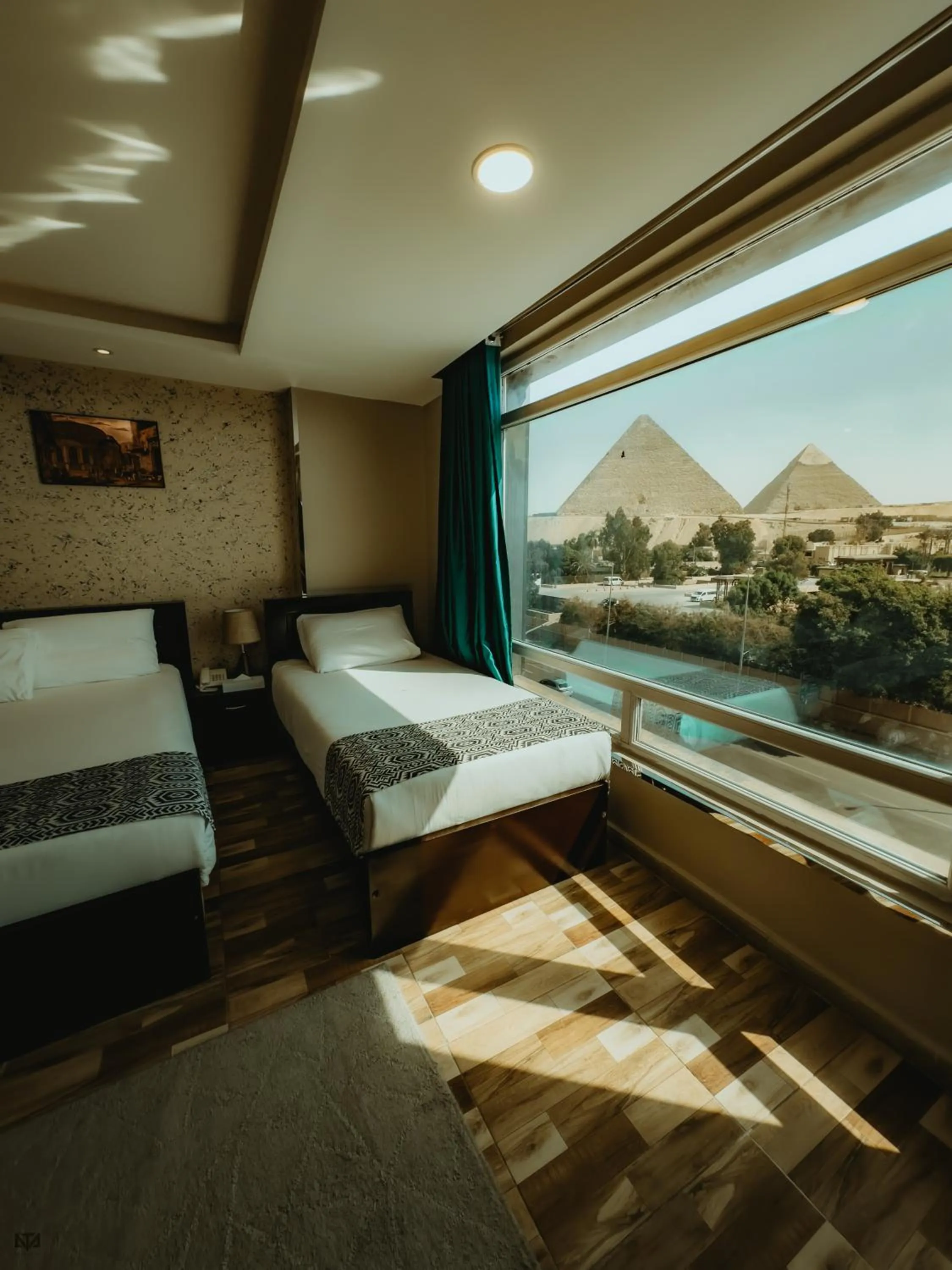 Bed in Turquoise Pyramids & Grand Egyptian museum view Hotel