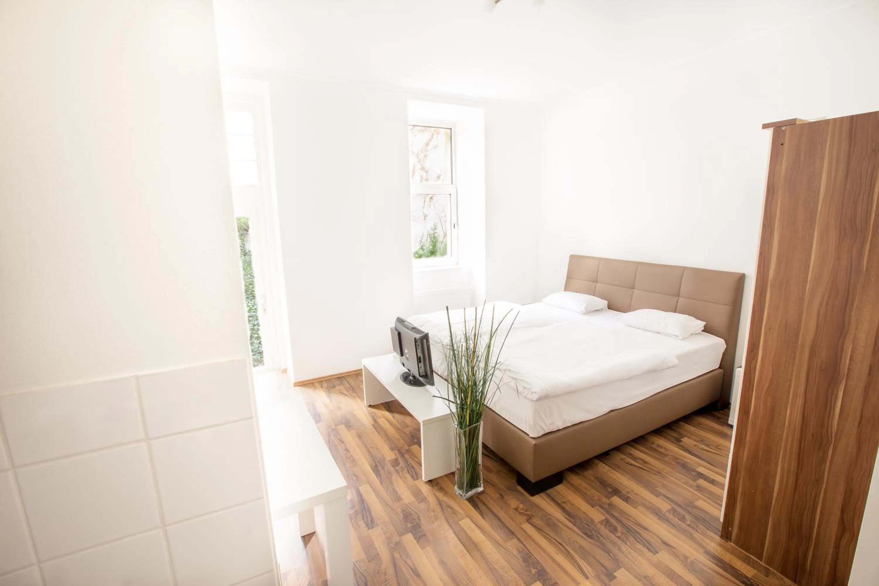 Bed in Grand Central Station Apartments I contactless check-in