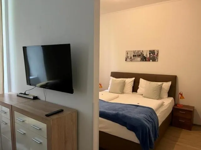 Bed in Grand Central Station Apartments I contactless check-in