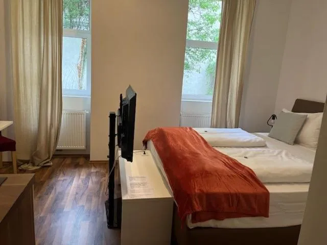 Bed in Grand Central Station Apartments I contactless check-in