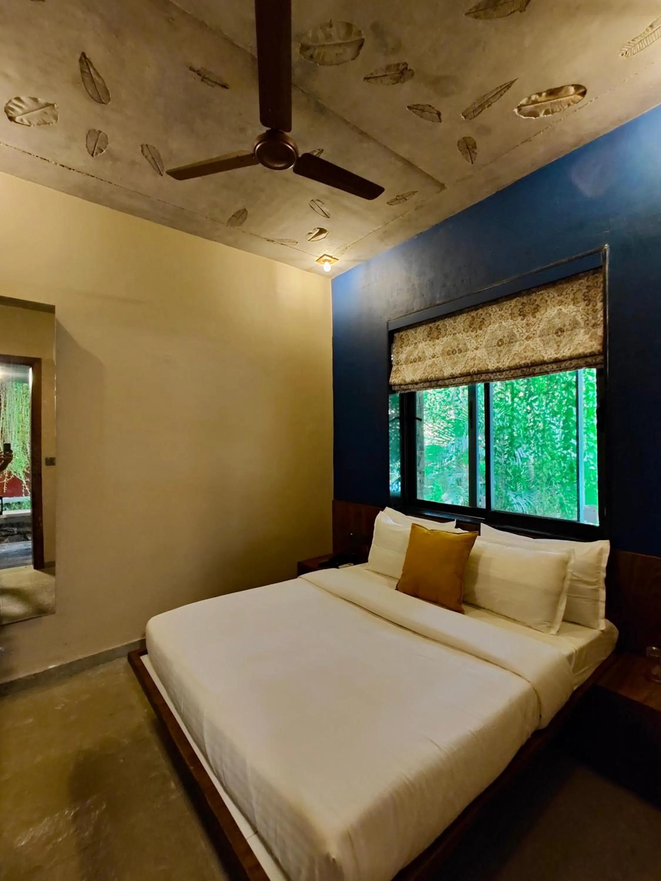 Bed in SaffronStays Kimaya, Alibaug