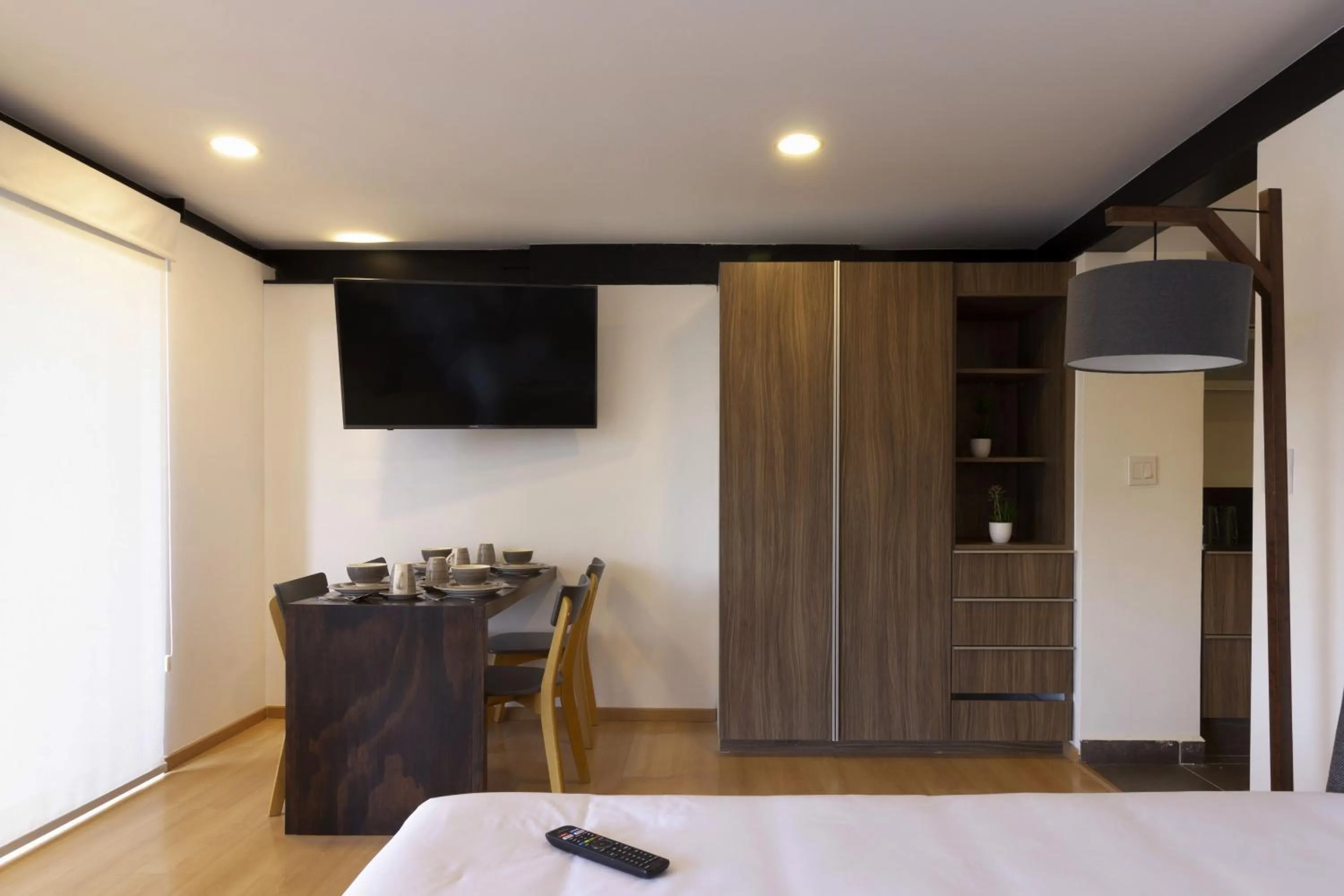 Communal lounge/ TV room, Bed in El Doce by HomiRent