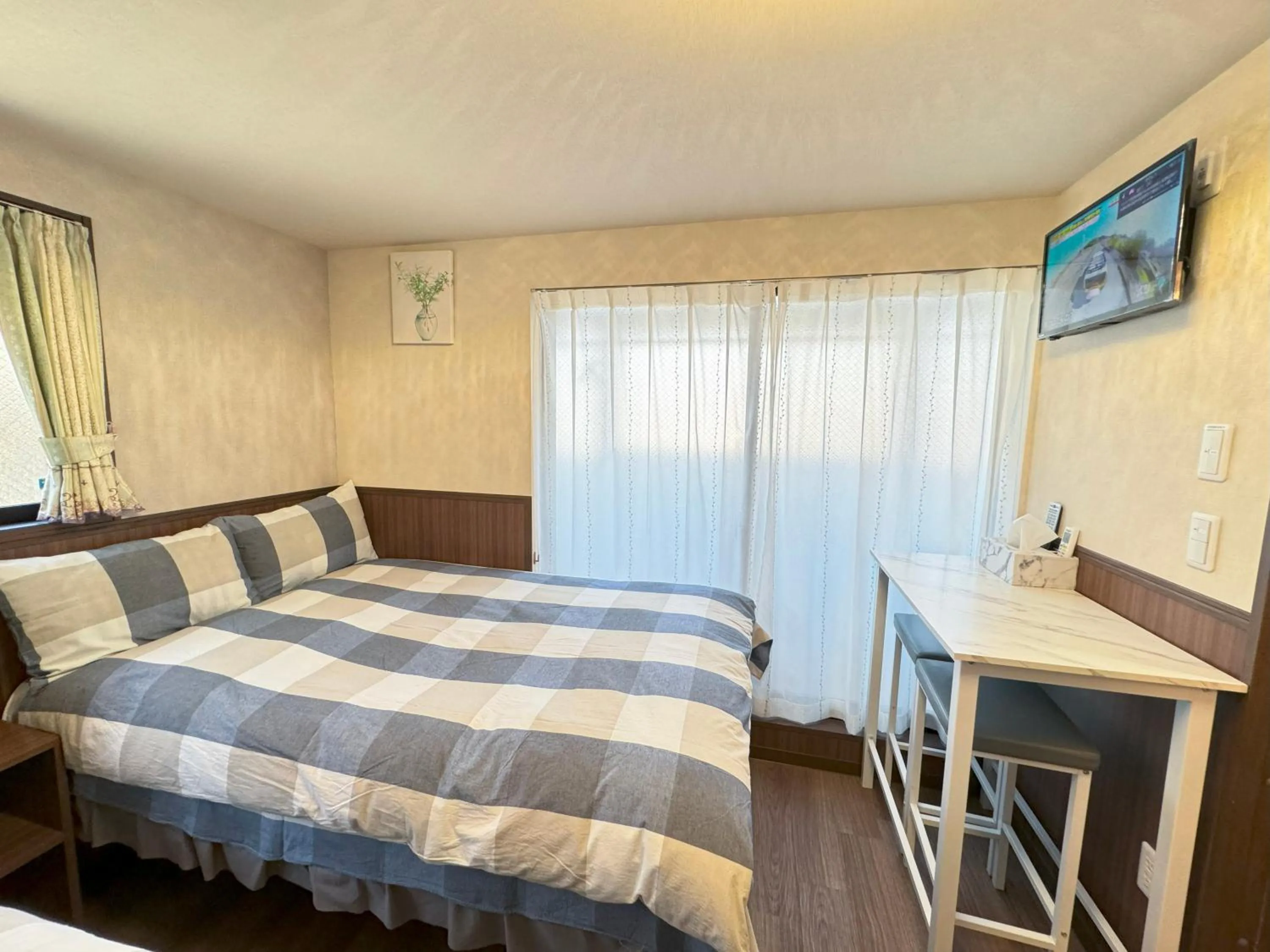 Bed in SHINJUKU WARM VILLA I