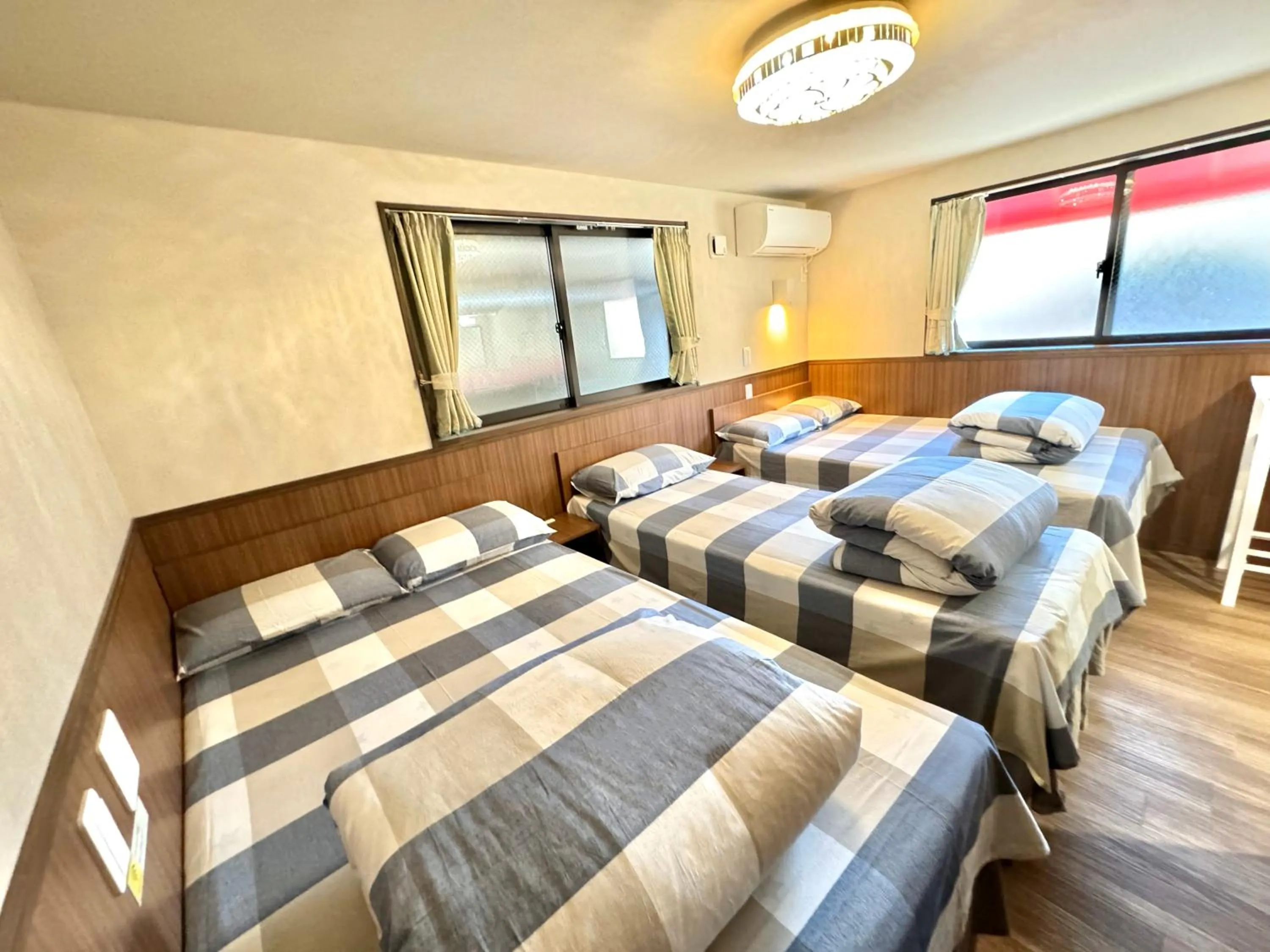 Bed in SHINJUKU WARM VILLA I