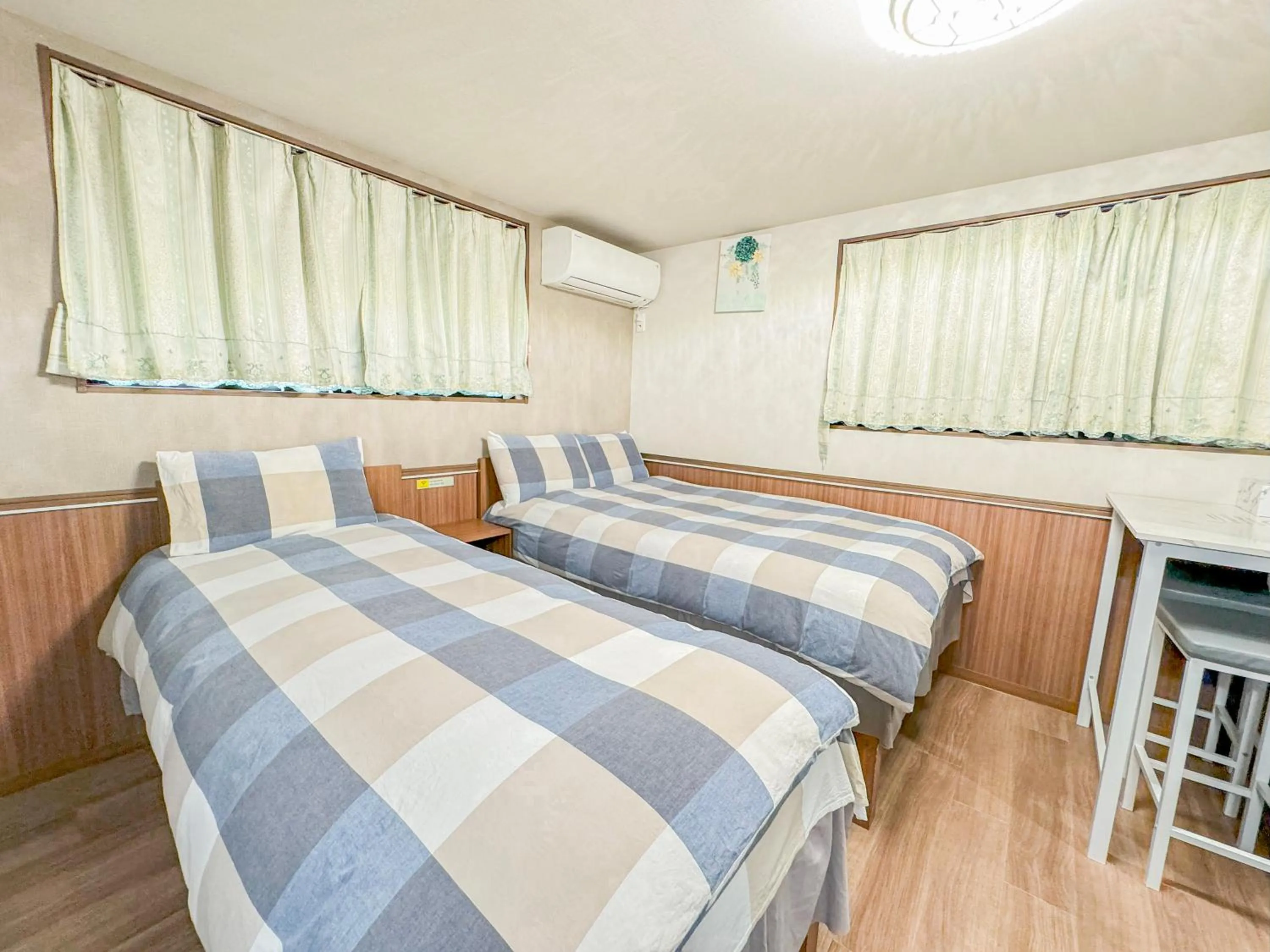 Bed in SHINJUKU WARM VILLA I