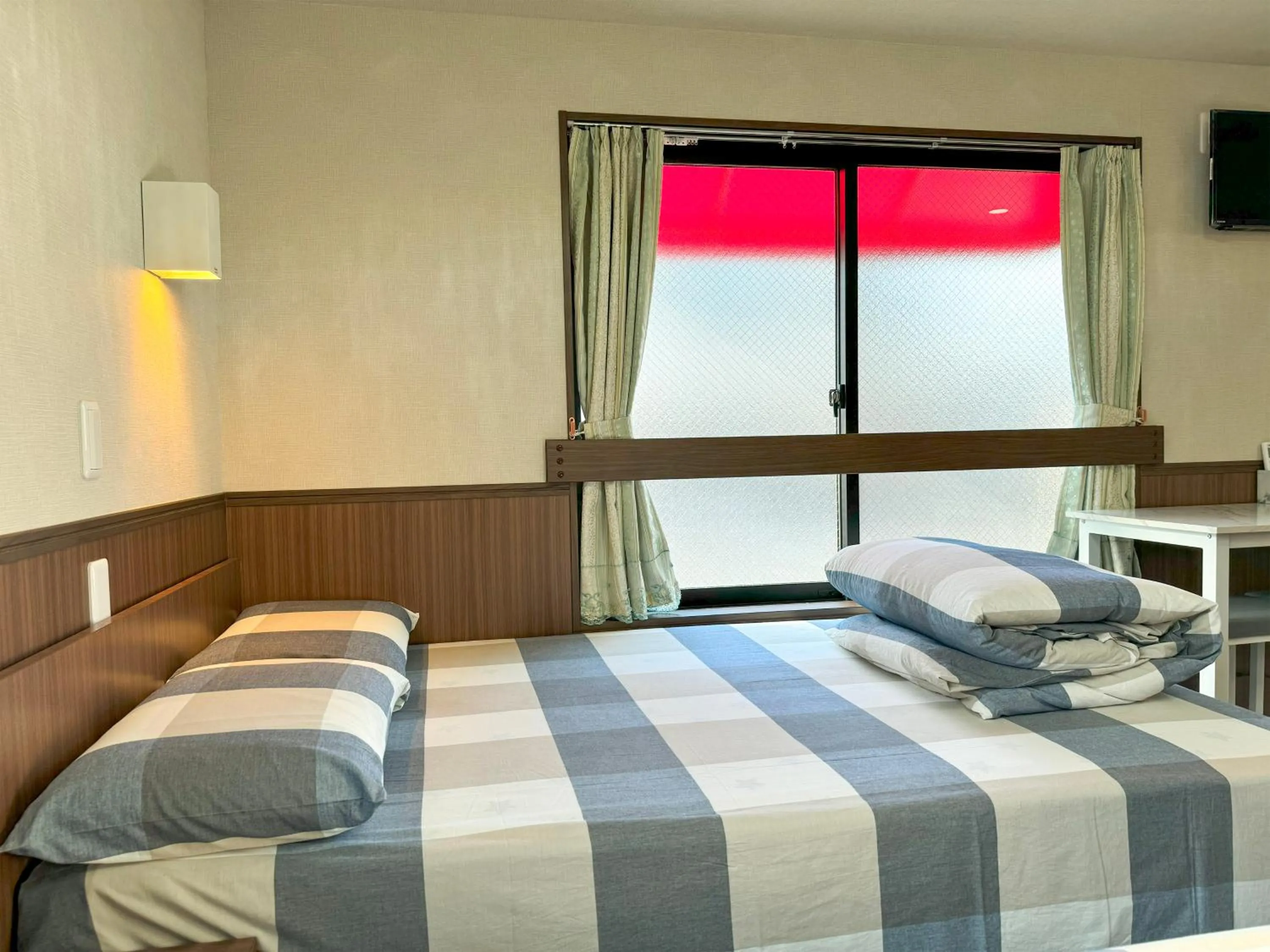 Bed in SHINJUKU WARM VILLA I