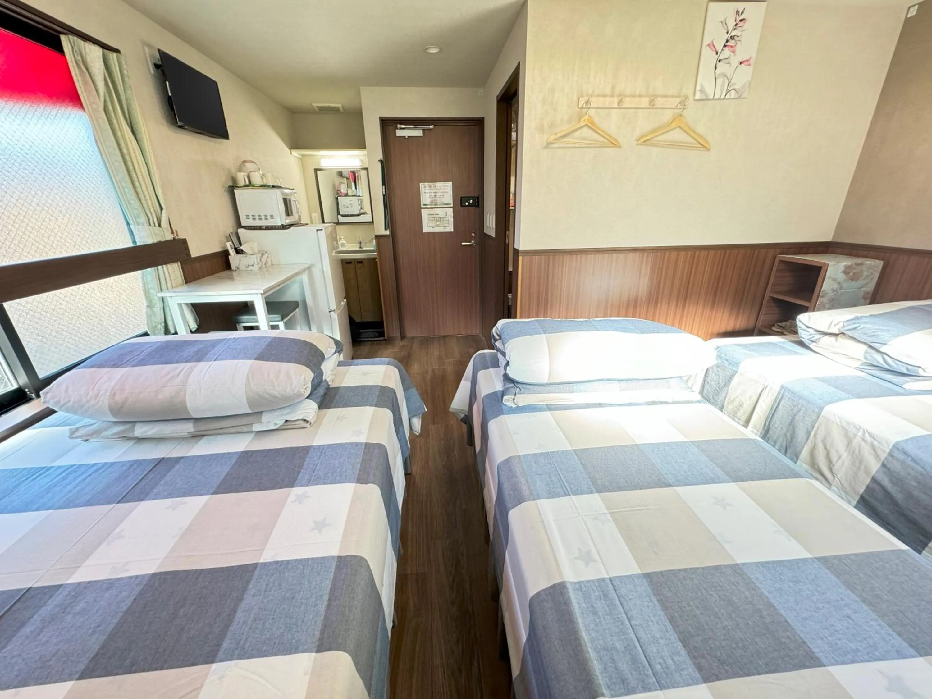 Bed in SHINJUKU WARM VILLA I