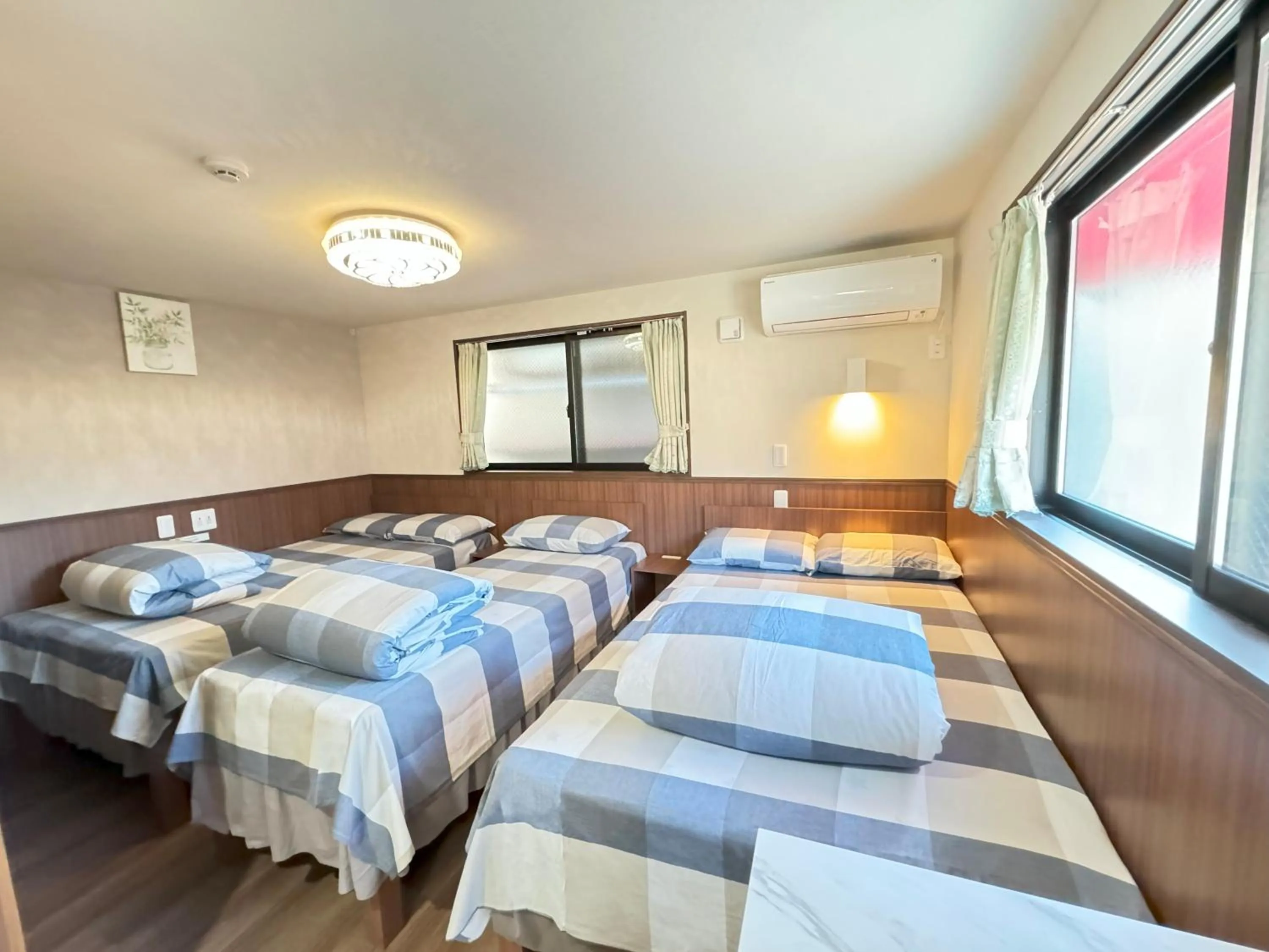 Bed in SHINJUKU WARM VILLA I