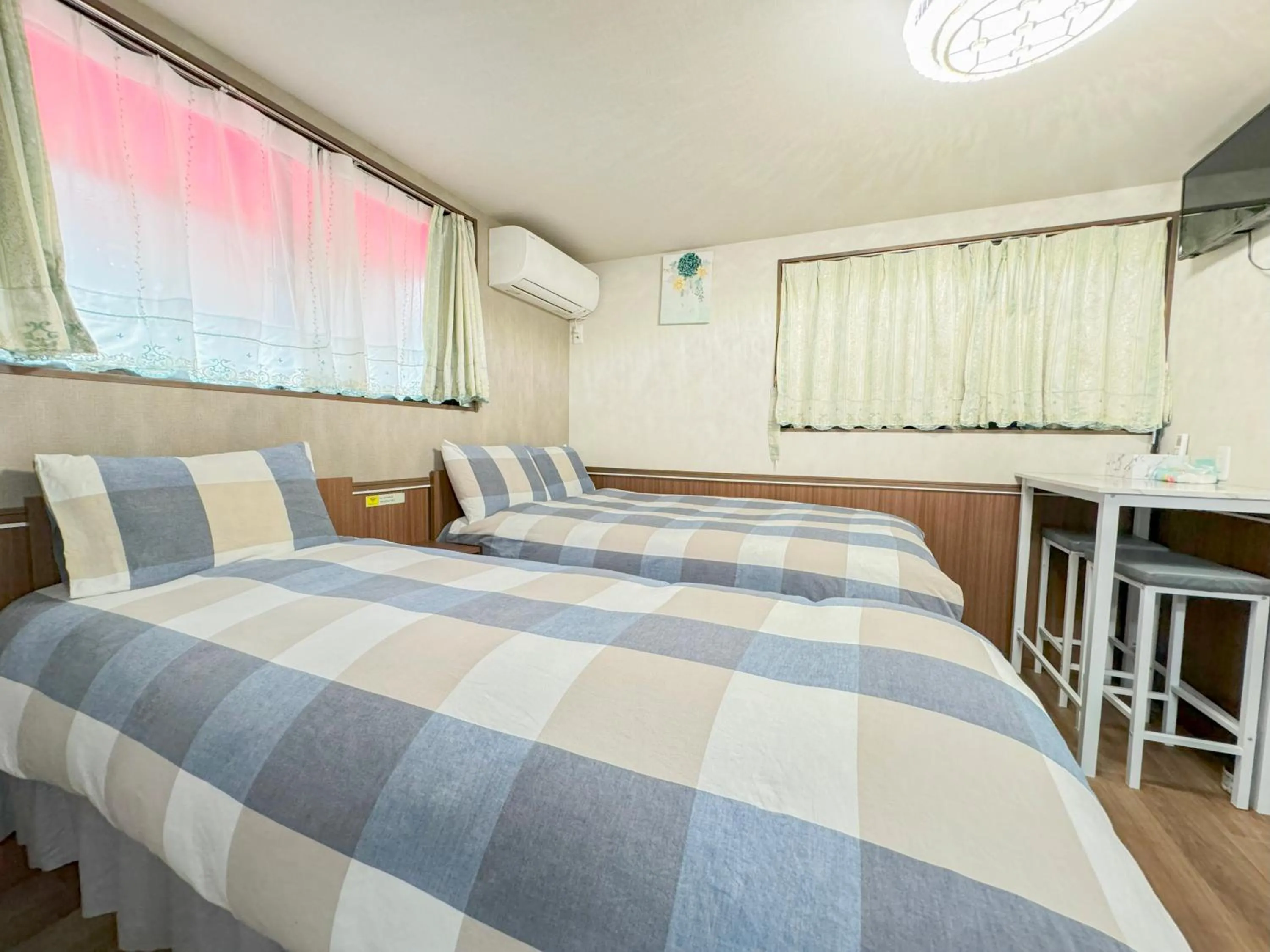 Bed in SHINJUKU WARM VILLA I