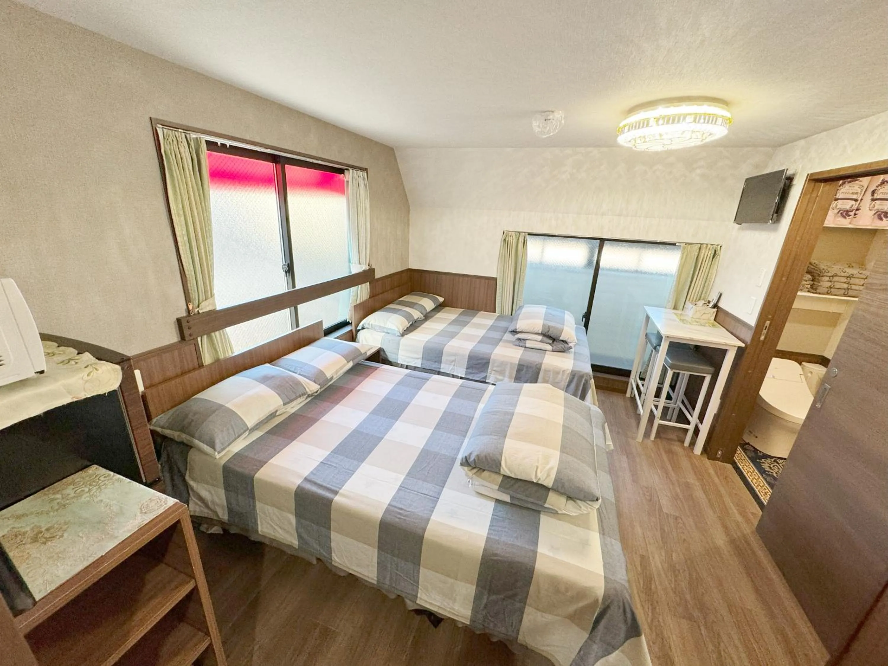 Bed in SHINJUKU WARM VILLA I