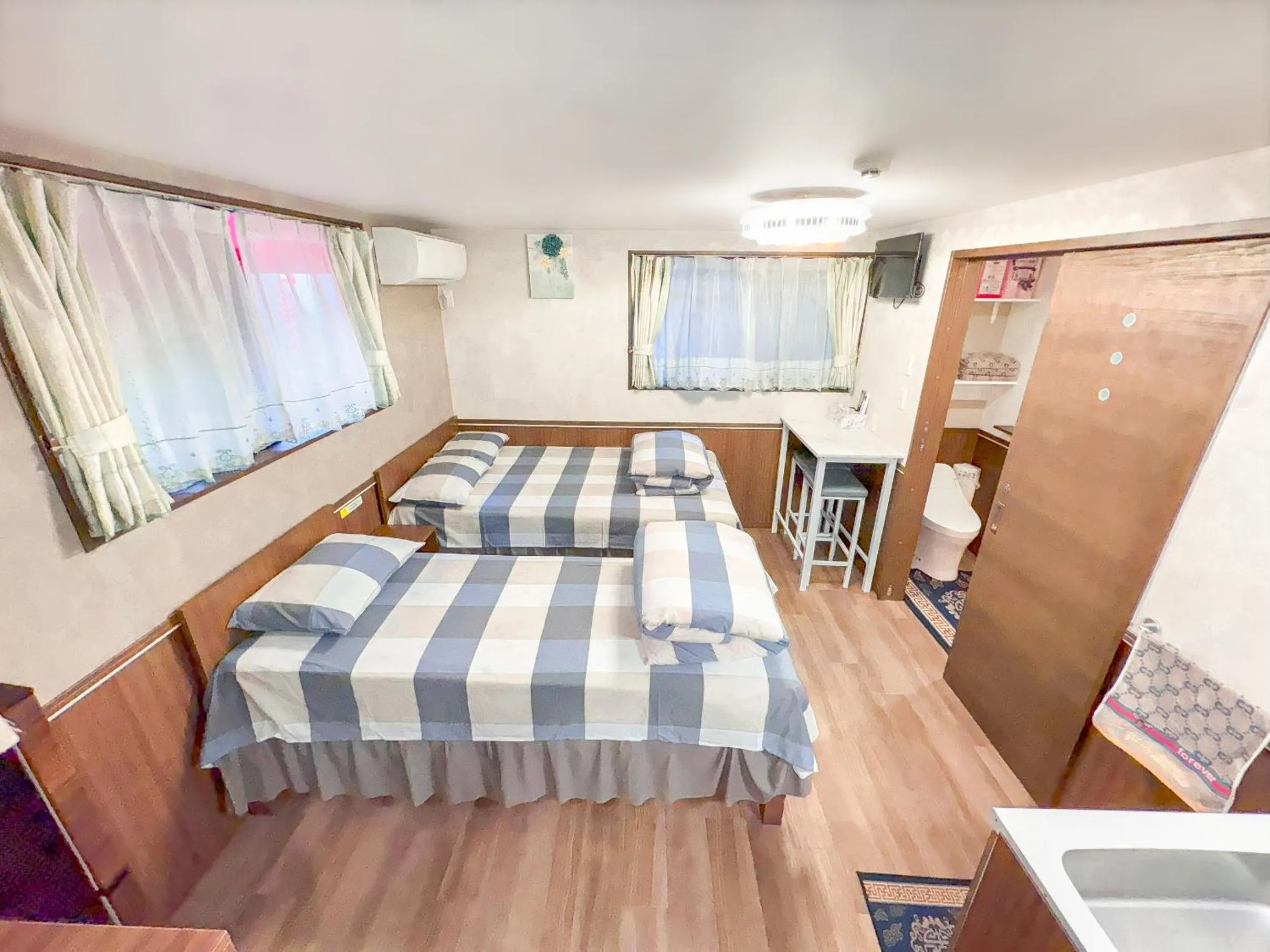 Bed in SHINJUKU WARM VILLA I