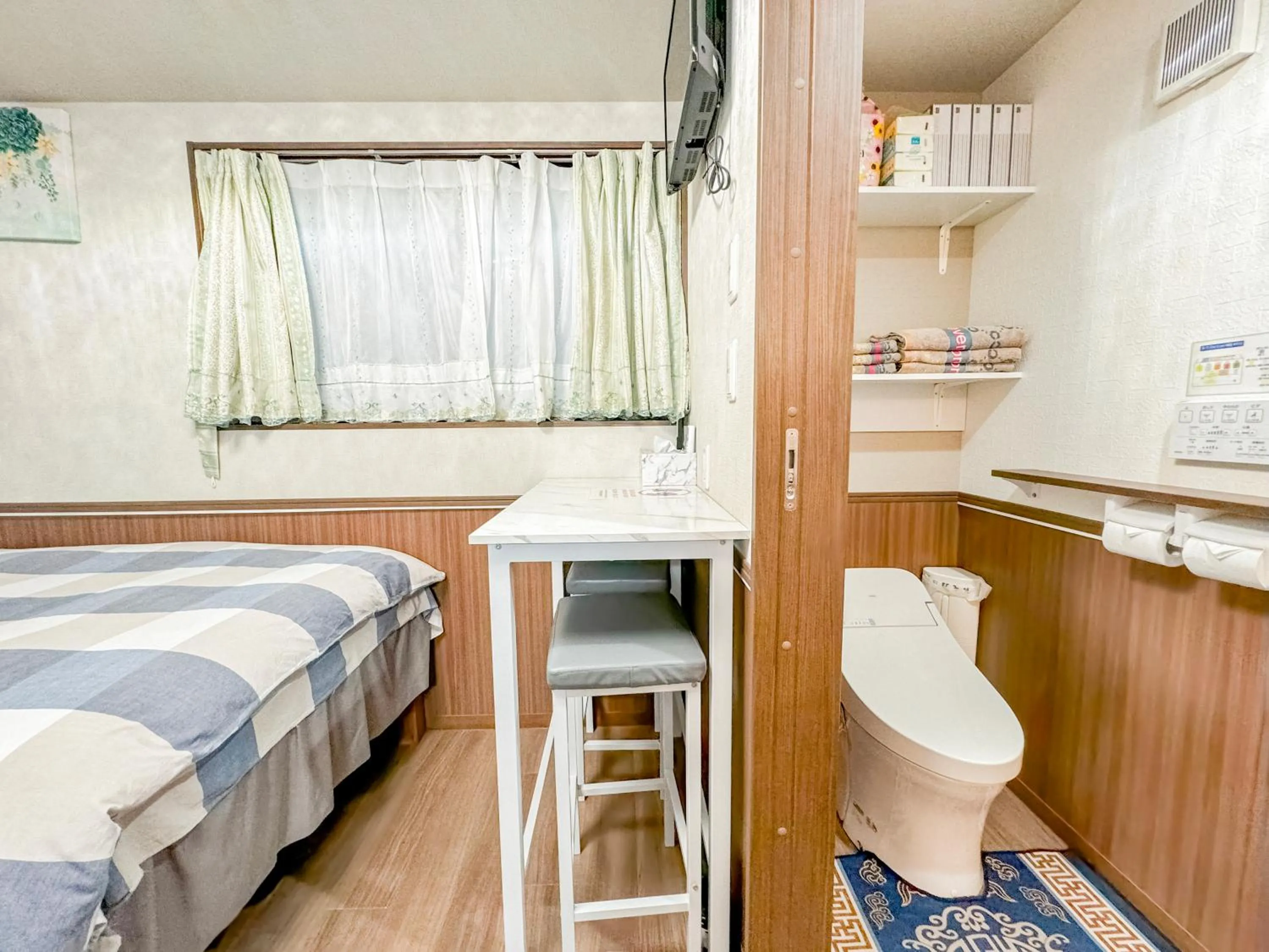 Bed in SHINJUKU WARM VILLA I