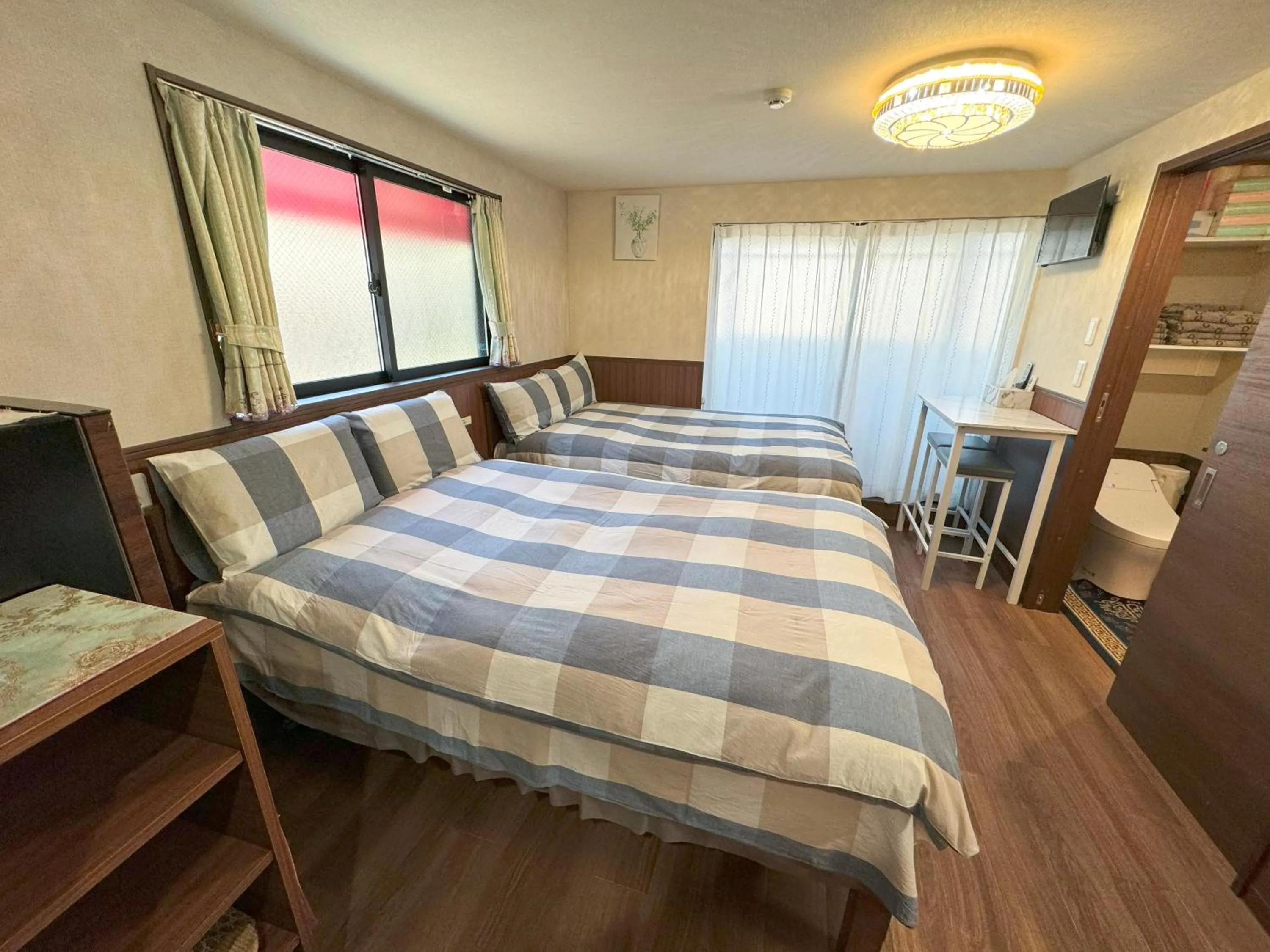 Bed in SHINJUKU WARM VILLA I