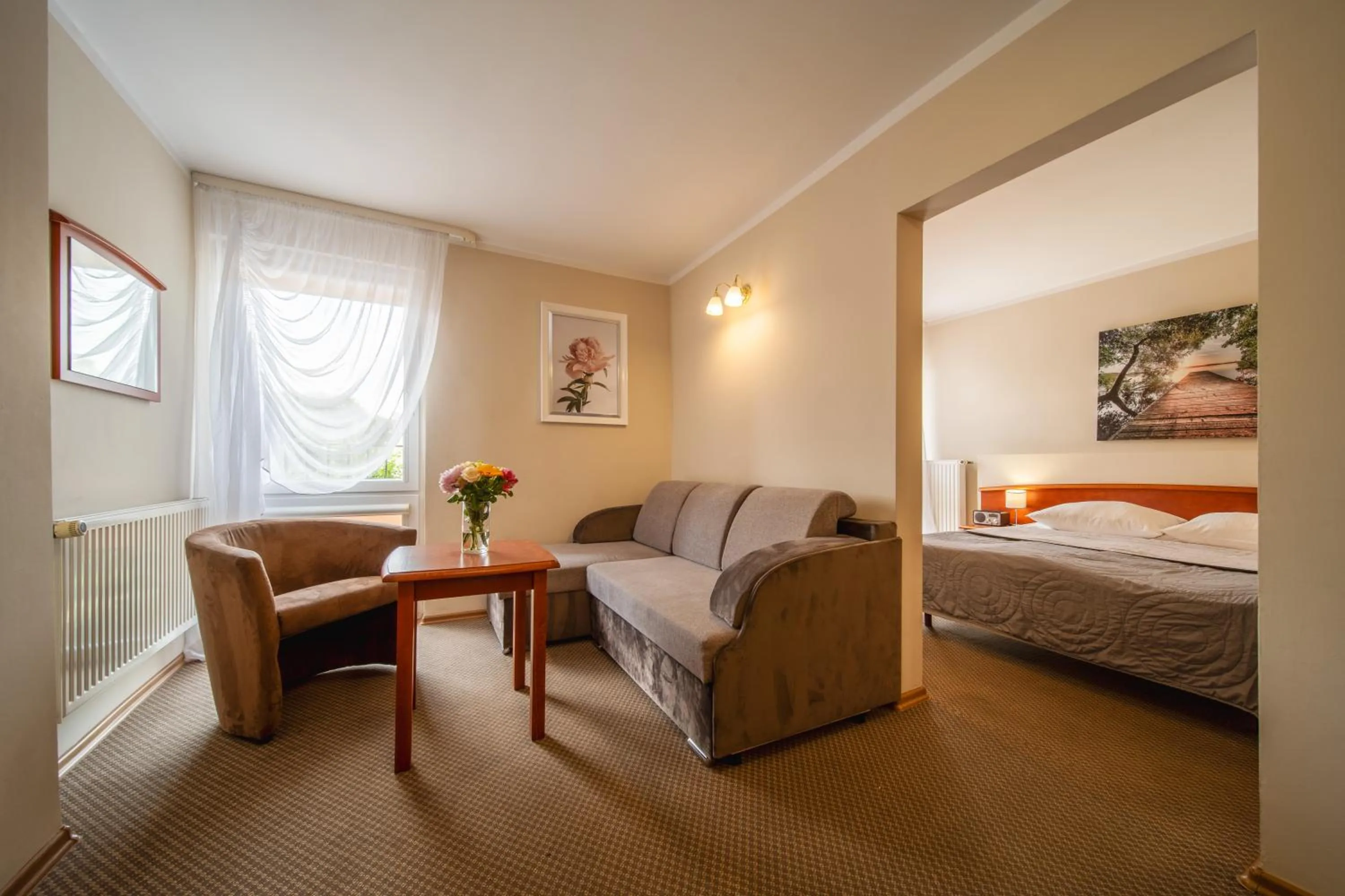 Seating area, Bed in Hotel Gromada Łomża