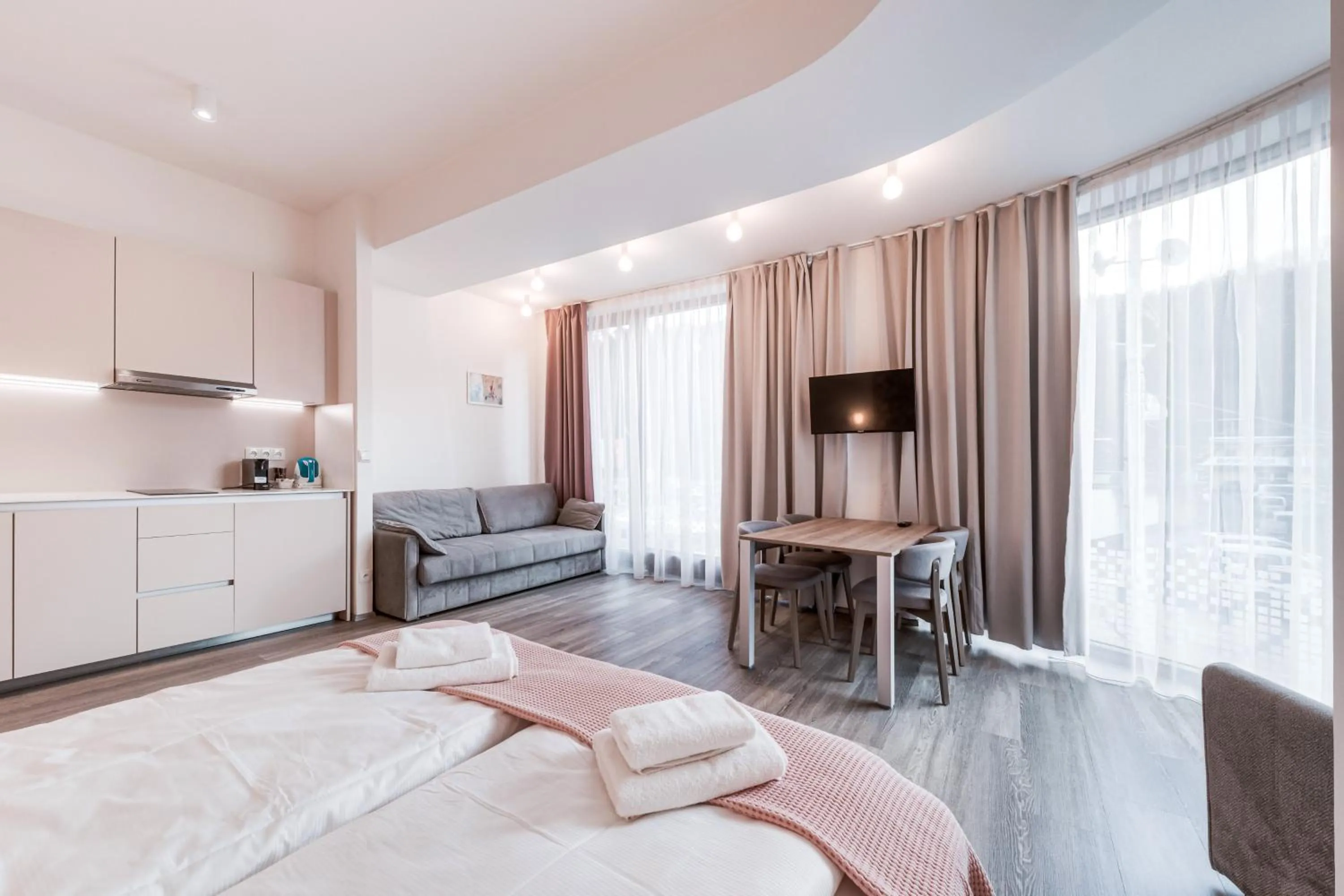 Living room, Bed in Kora Apartments