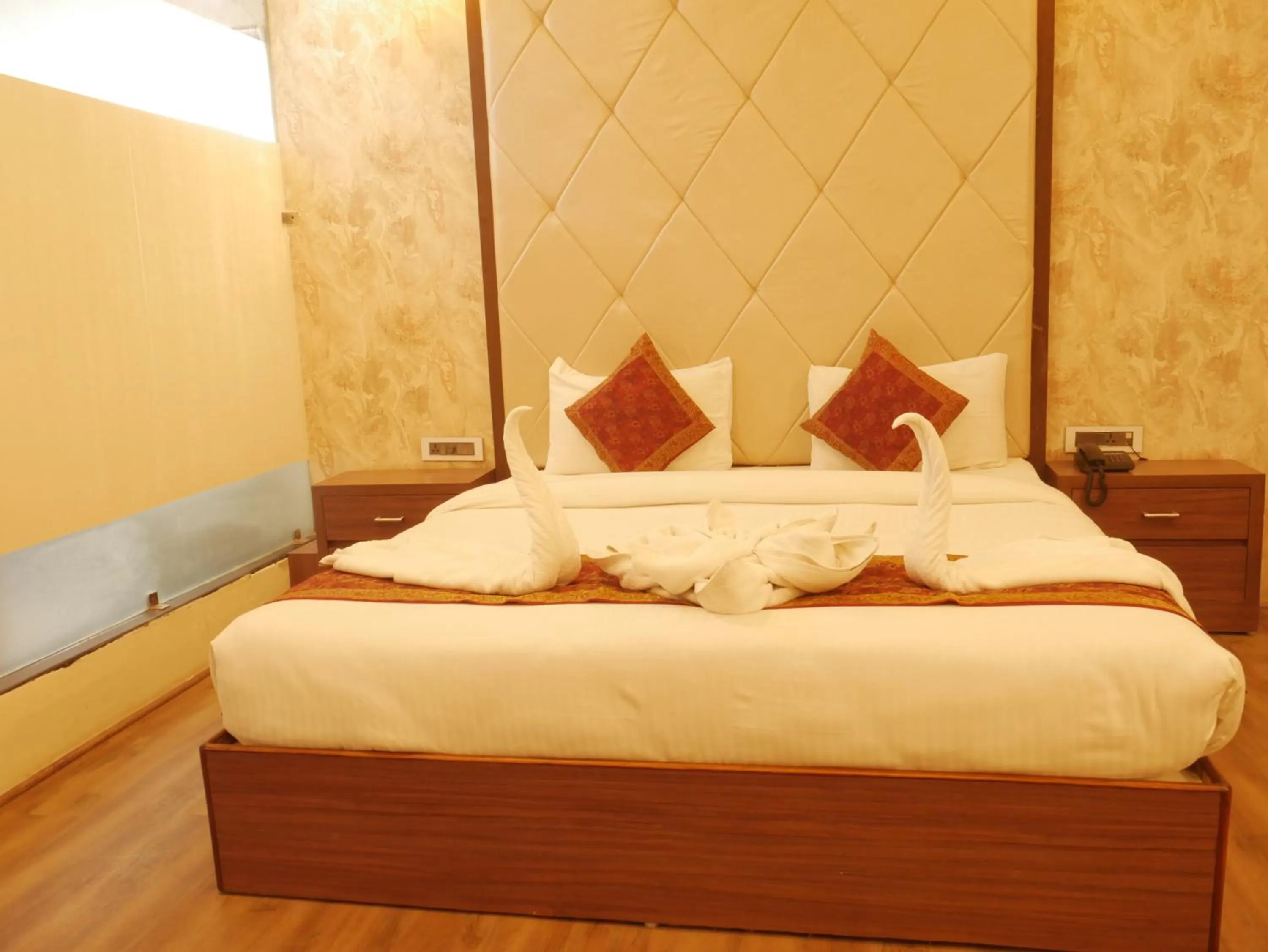 Bedroom in THE TRIUMPH HOTEL