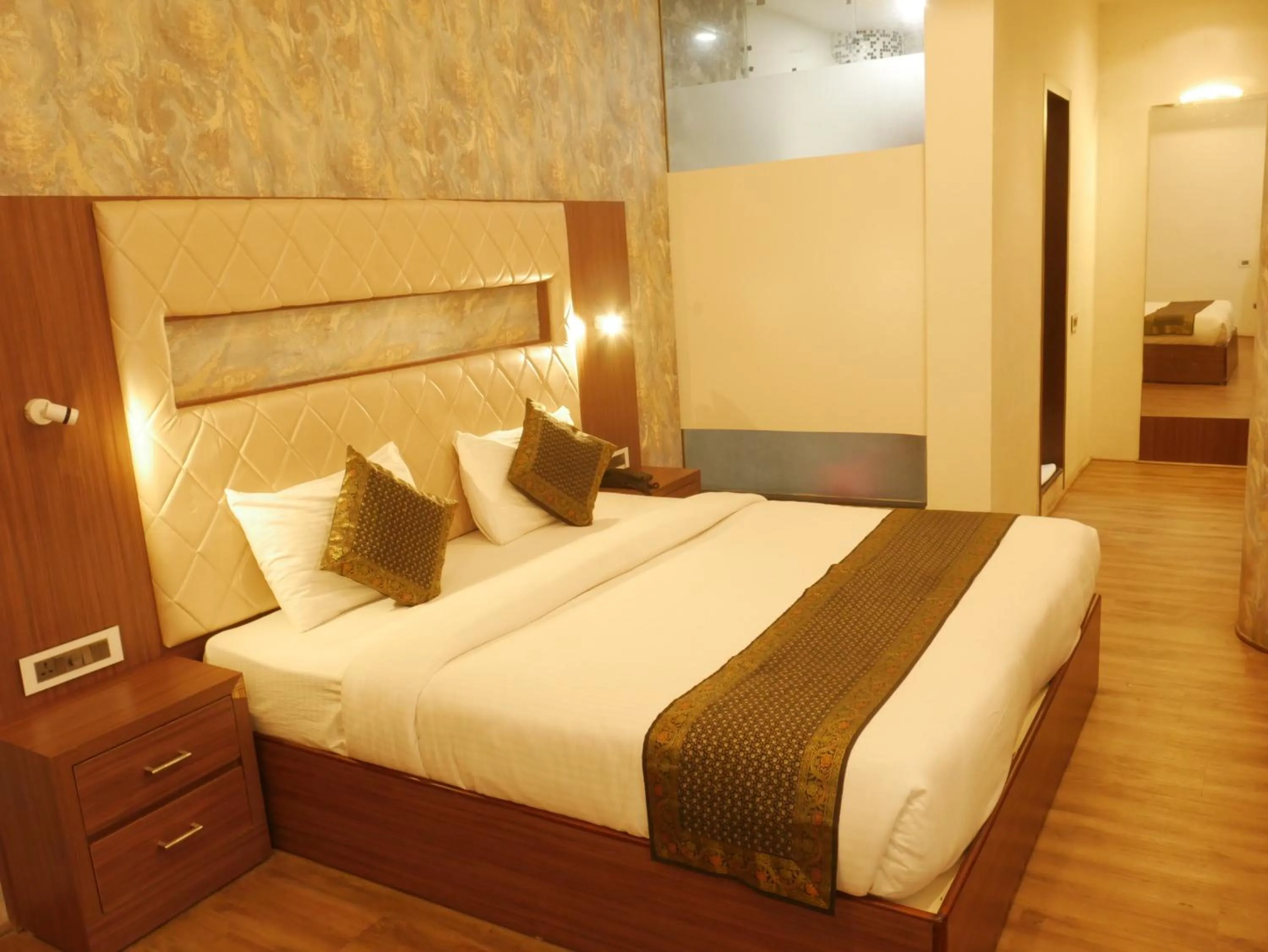 Bedroom in THE TRIUMPH HOTEL