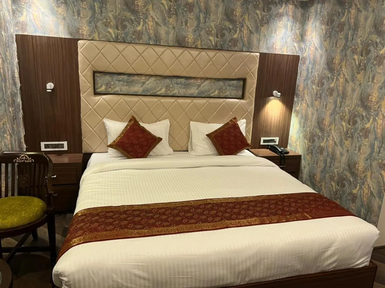 Bed in THE TRIUMPH HOTEL