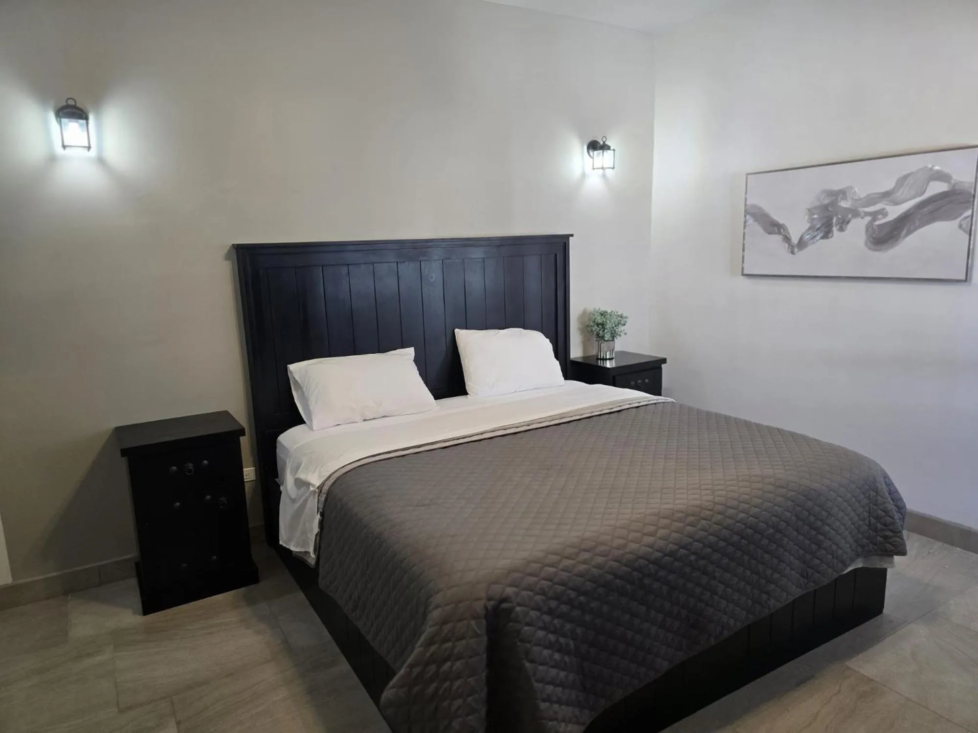 Bed in Playas Hotel Suites