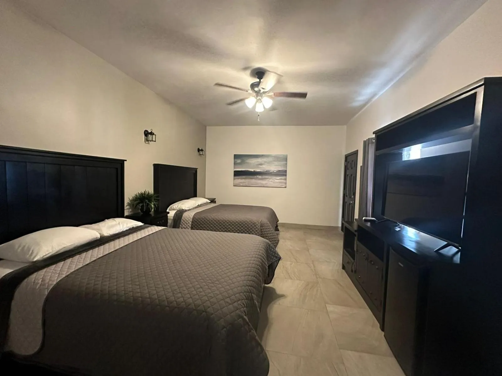 Bed in Playas Hotel Suites