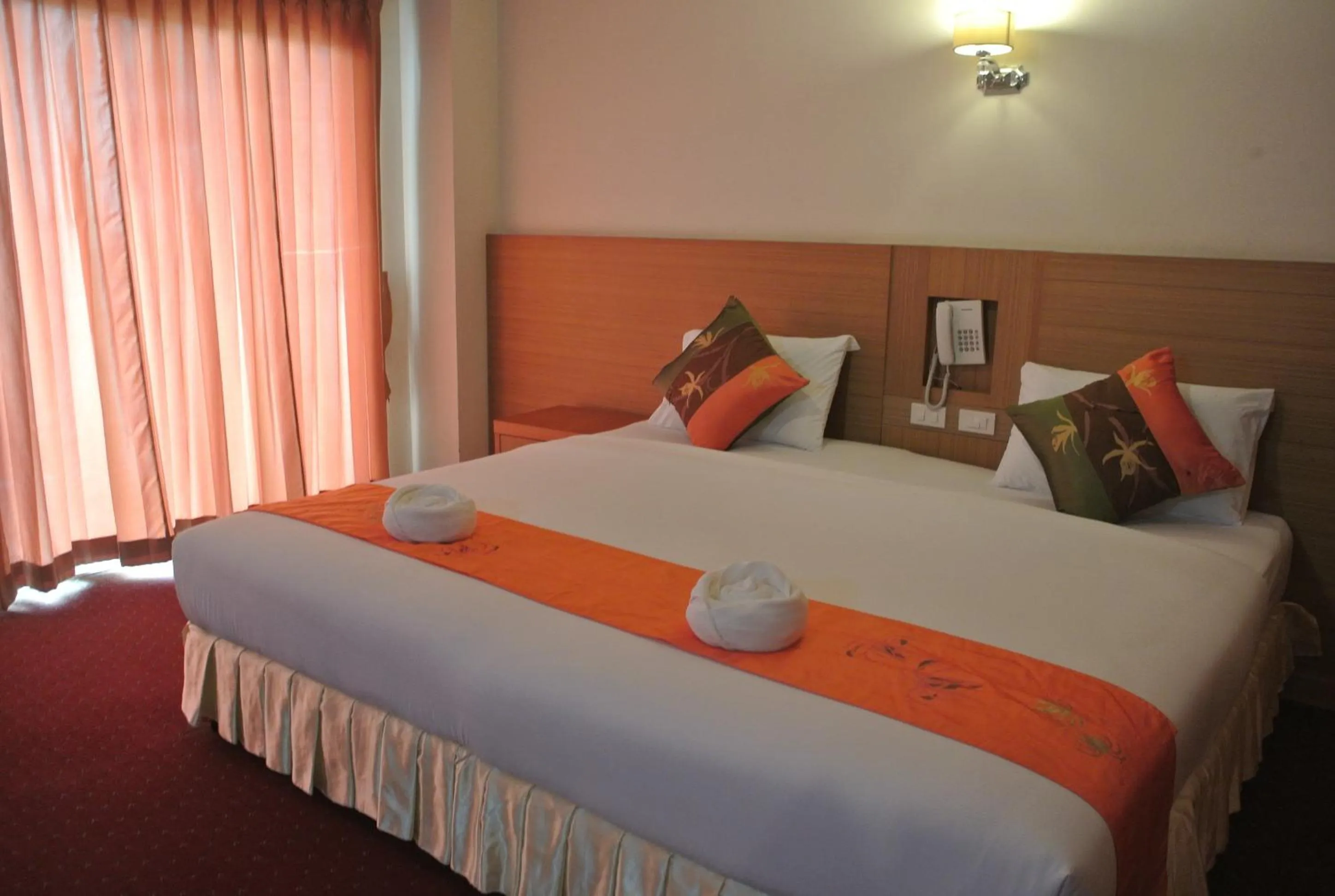 Bed in Chaikana Thani Hotel