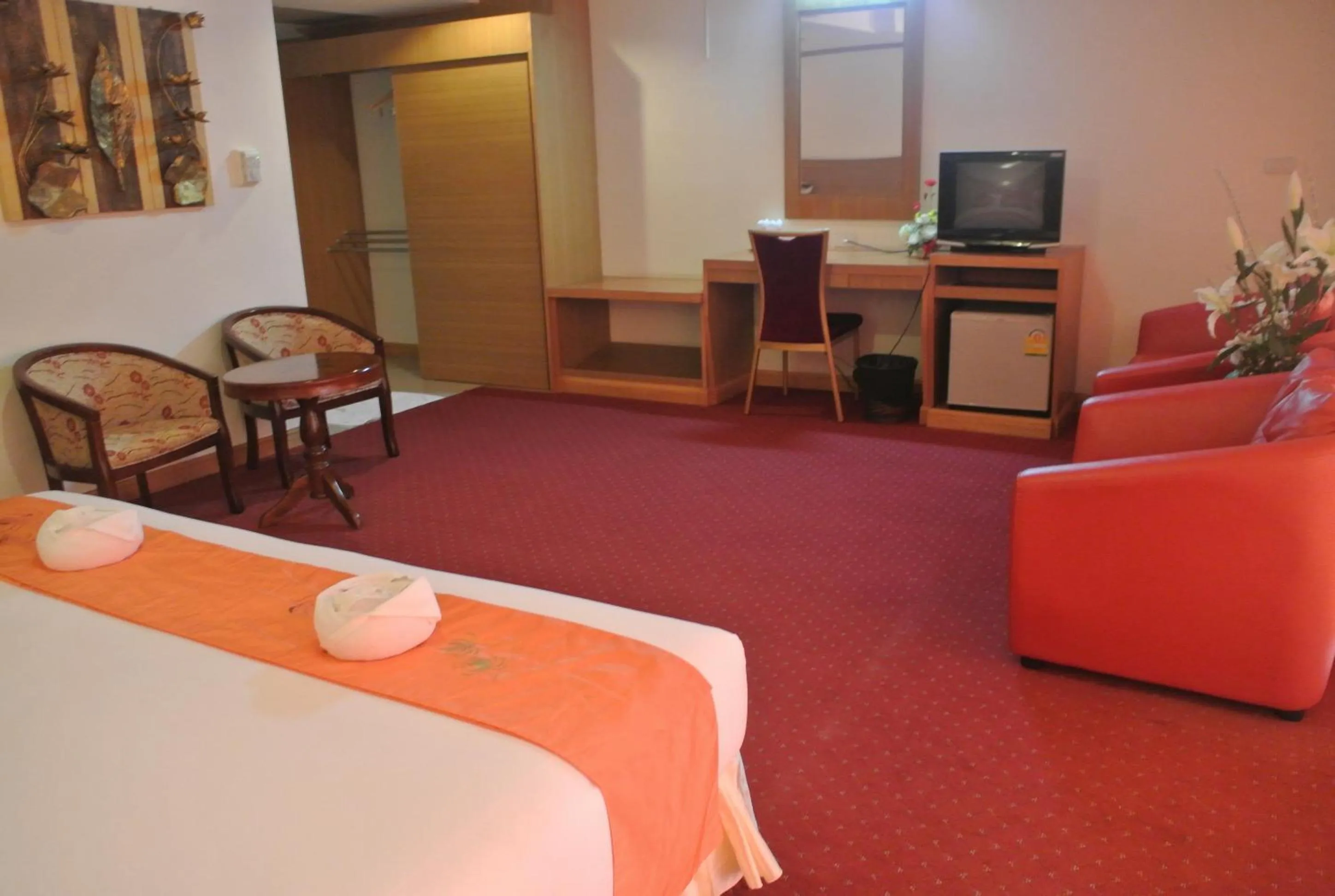 Bed in Chaikana Thani Hotel