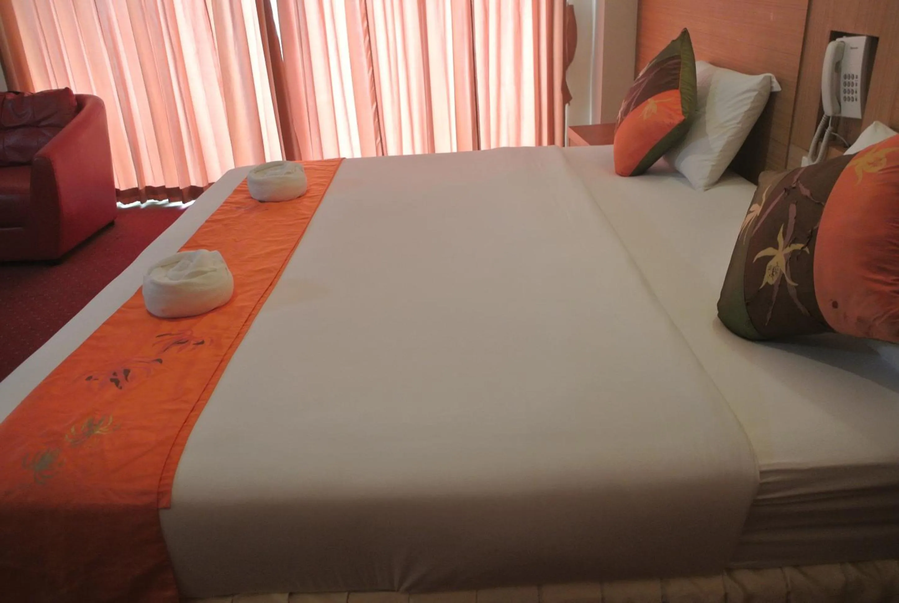 Bed in Chaikana Thani Hotel