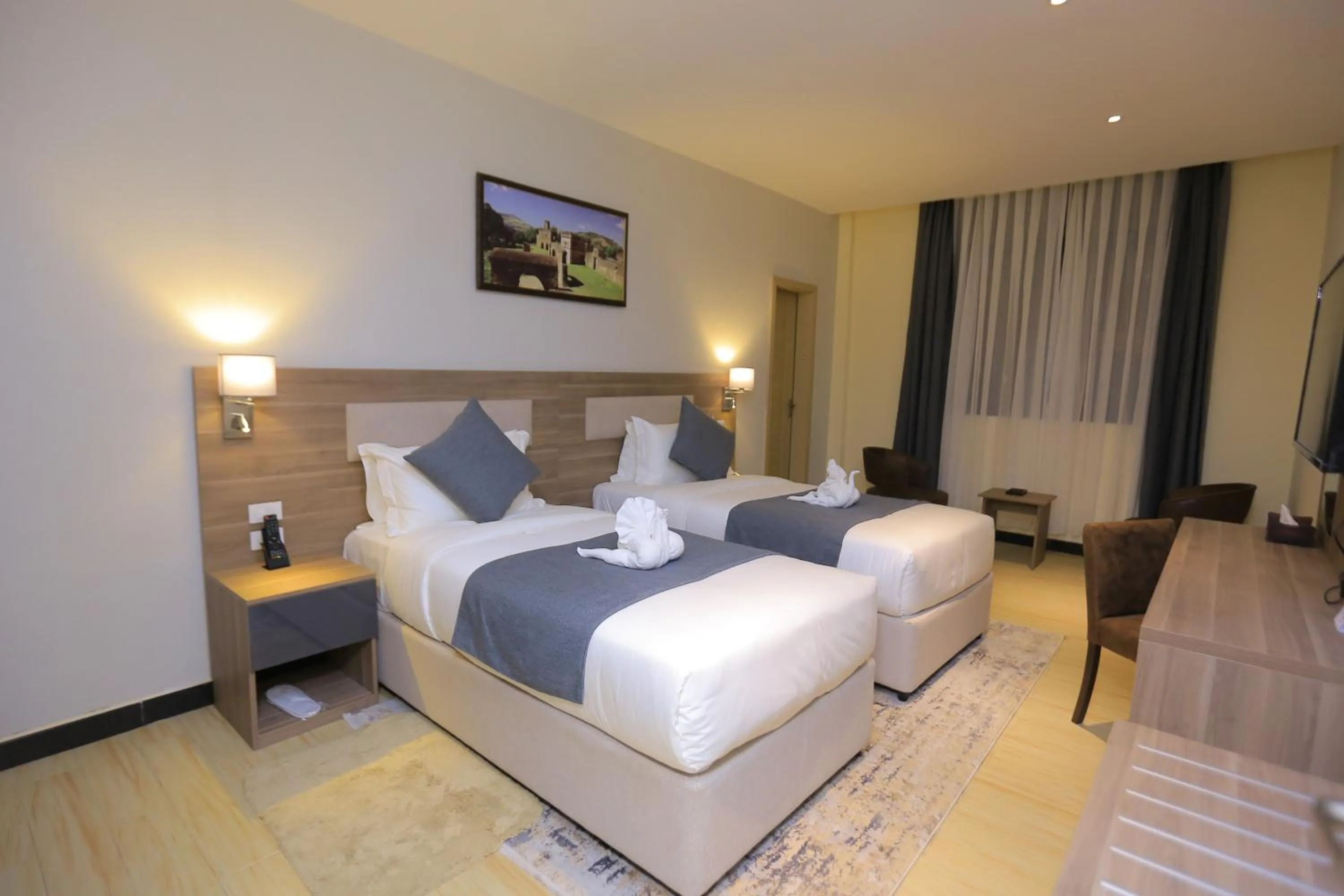 Bed in Triple E Hotel and Spa