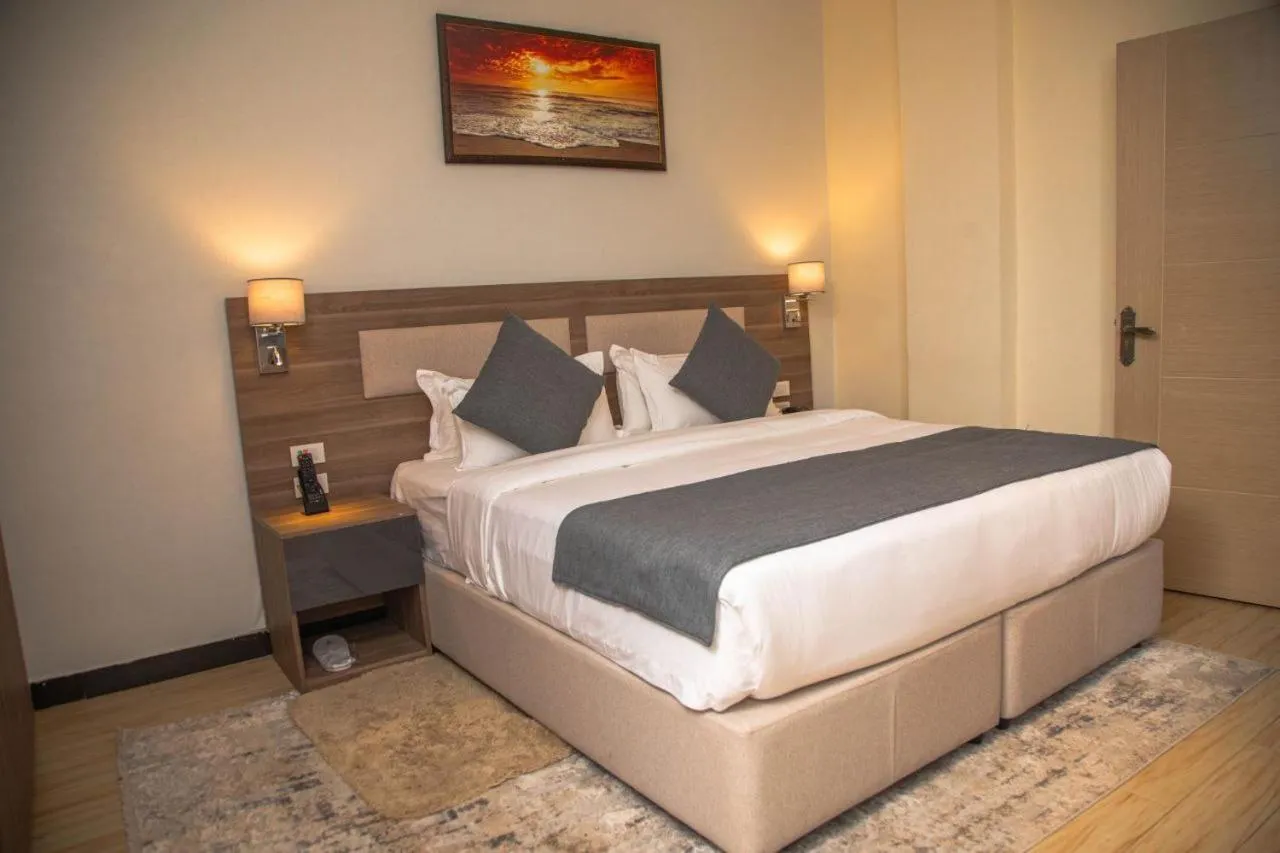 Bed in Triple E Hotel and Spa